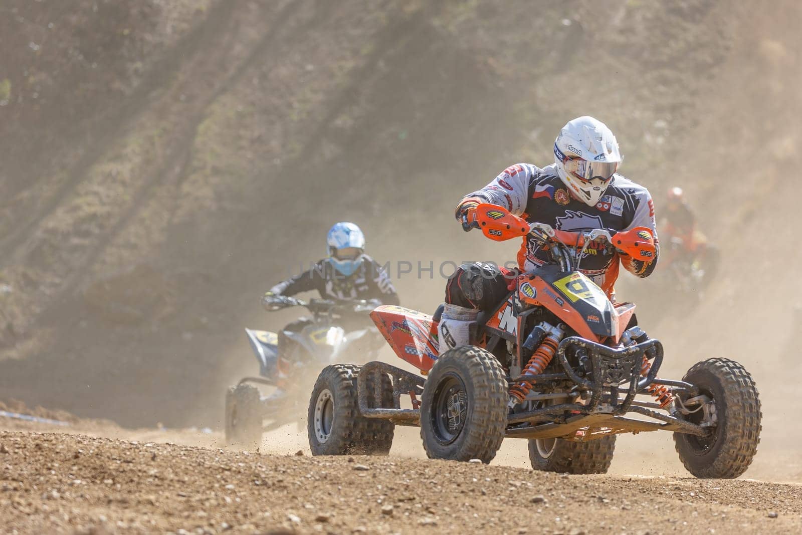 MOHELNICE,  CZECH REPUBLIC - APRIL 16, 2022: Riders on a quad bike in left turn in International Championship of Czech Republic in Sidecarcross, category Quad on April 16, 2022 in Mohelnice.