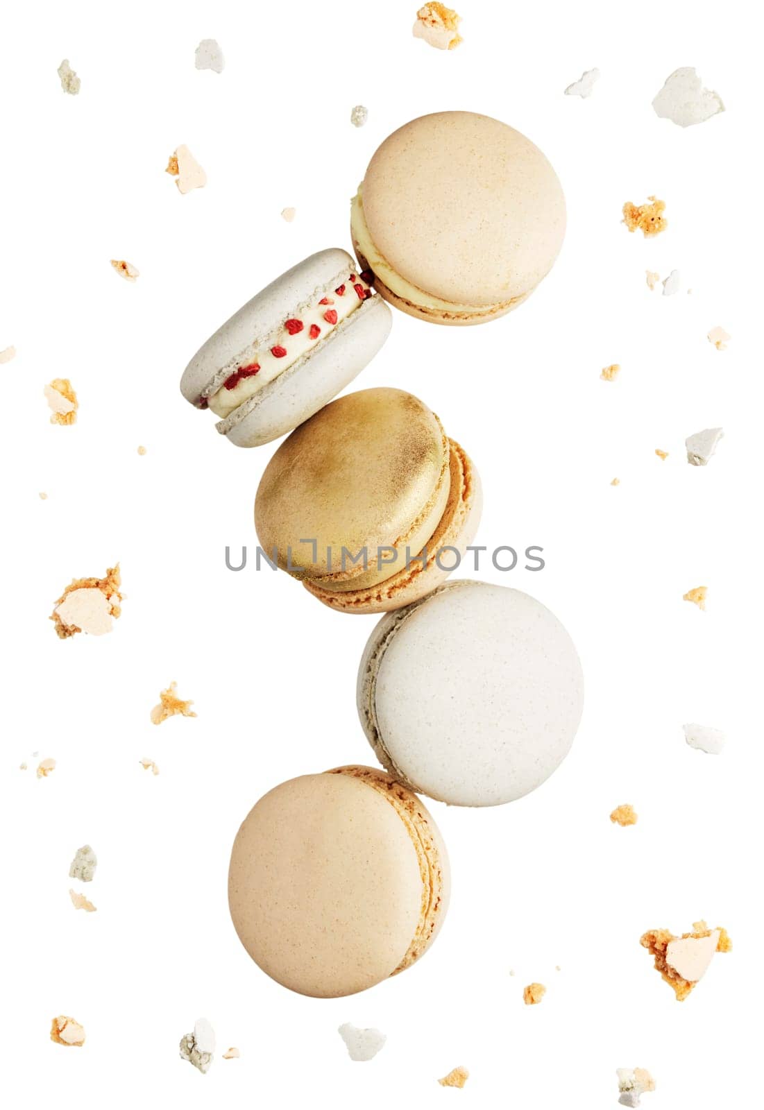 Isolated on white background white, yellow, gold macaron cookies flying, falling in motion or levitating. Colorful, sweet small French macaroon cakes. Five full cookies isolate. Broken cuts around