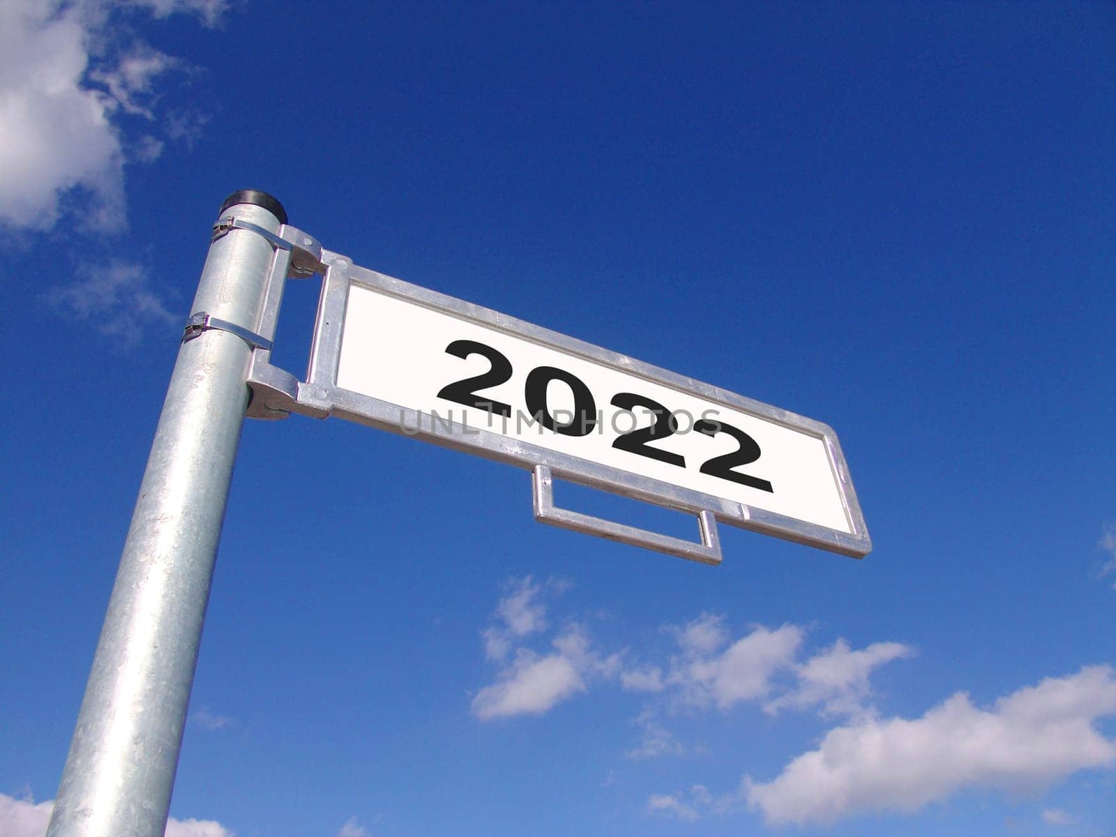 Street sign showing year 2022 with blue sky