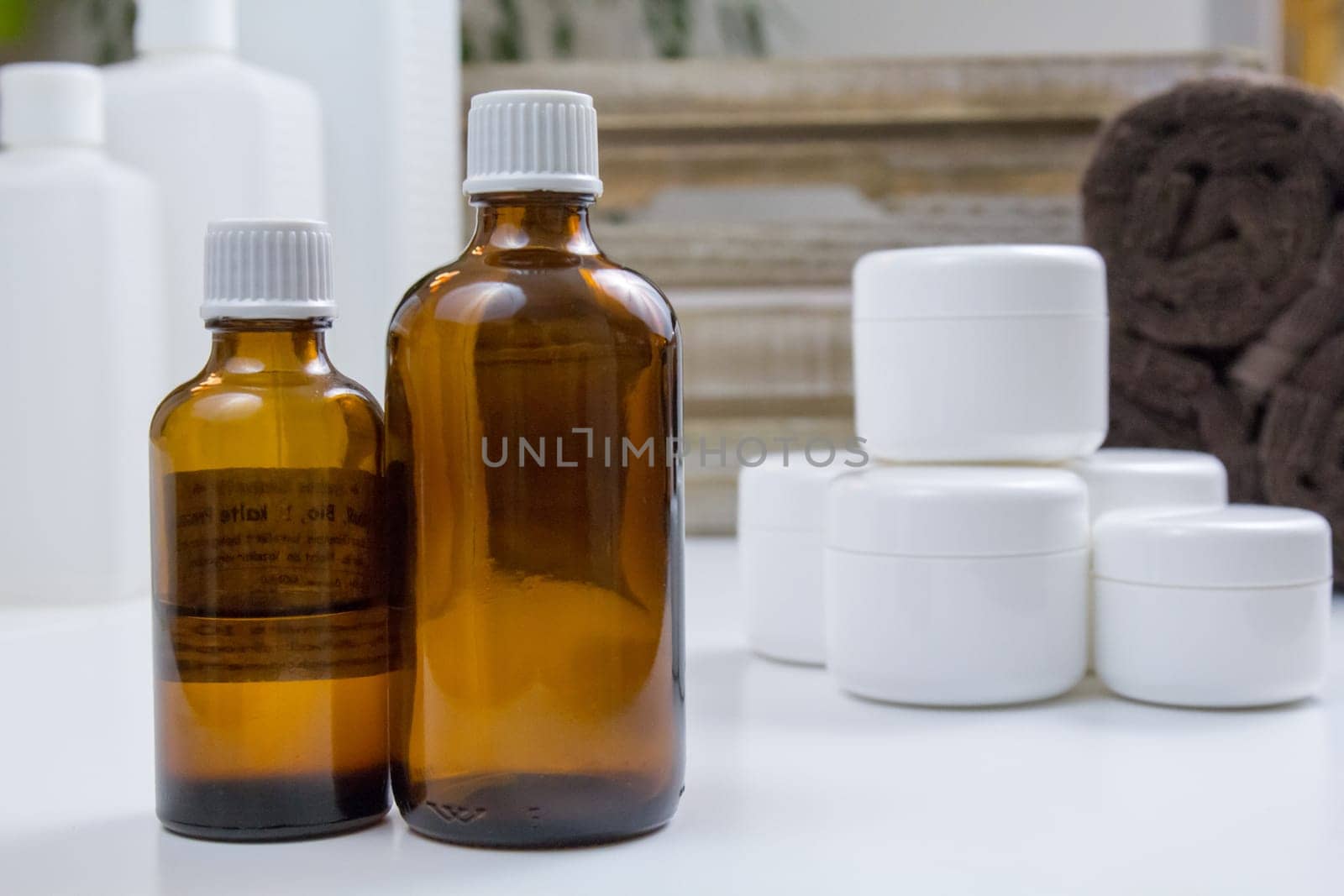 Glass bottle,cream and towels