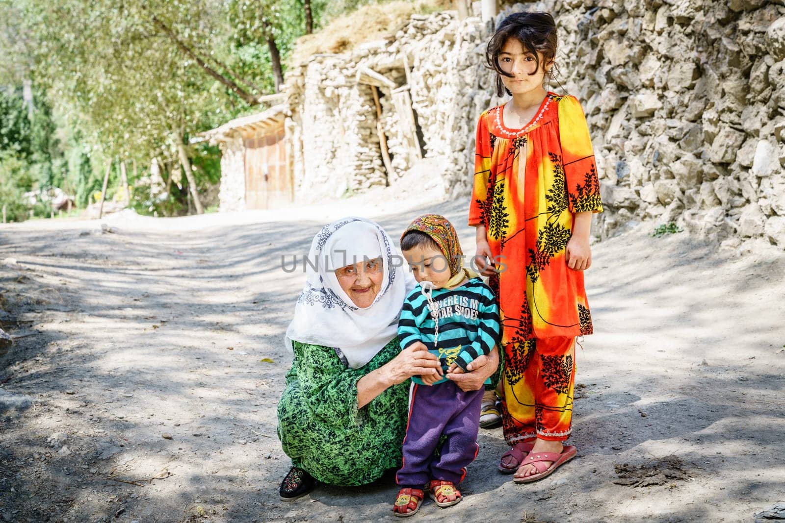August 26, 2016, Margib village, Tajikistan: Local children with their grandmother in a small village in Yaghnob region of Tajikistan