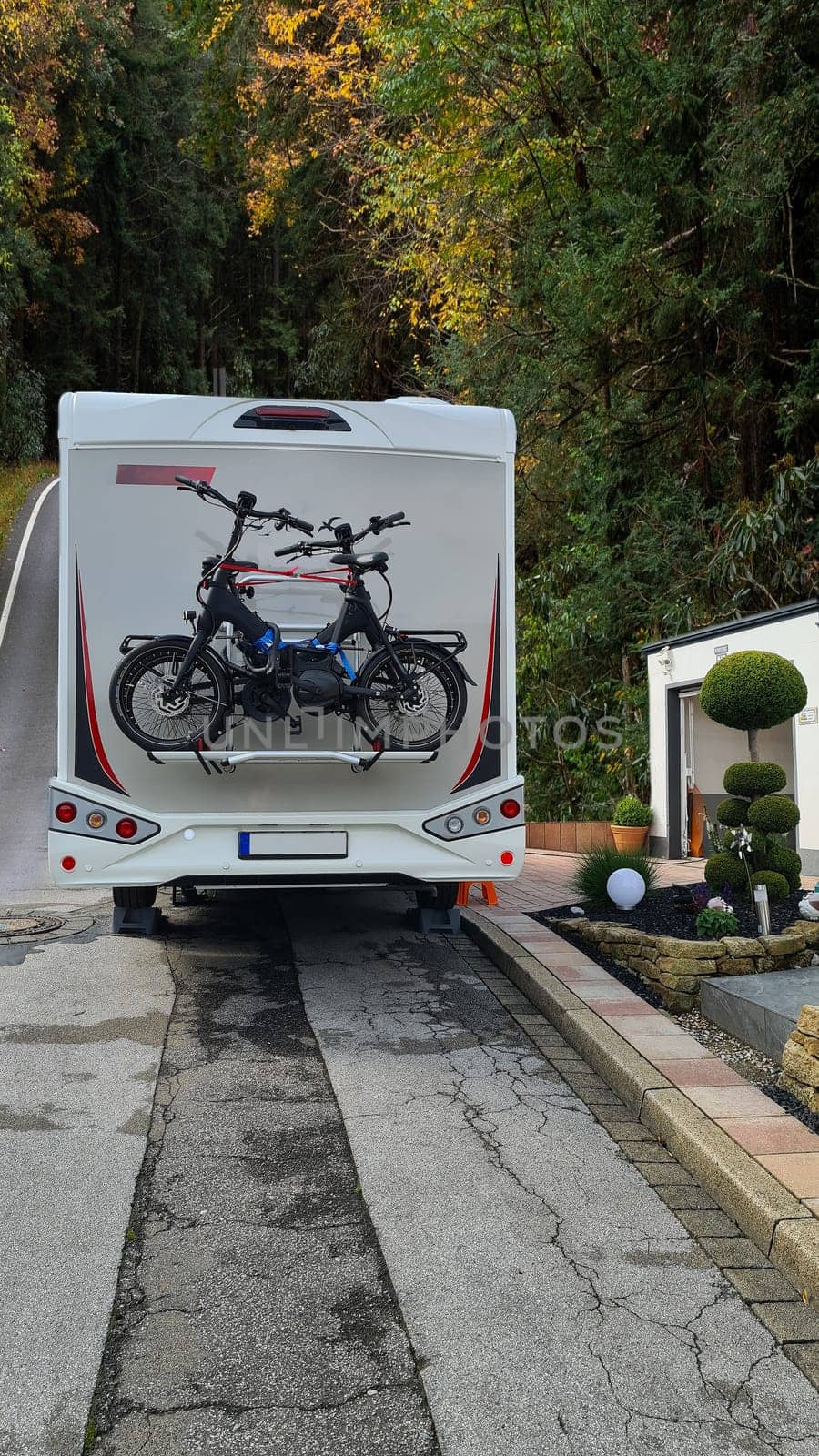 Bike racks on the camper. Campervan bikes on the rear rack of the RV for an outdoor nomadic lifestyle van camper van caravan vehicle for vacation trip living RV camping in the parking lot