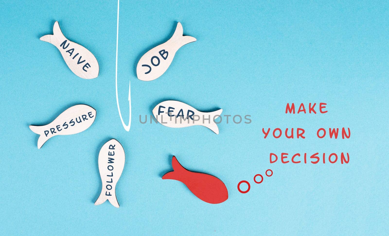 Group of fishes with words like fear, pressure, follower swimming to the fishing rod, red fish makes his own decision, takes a different direction, against the stream
