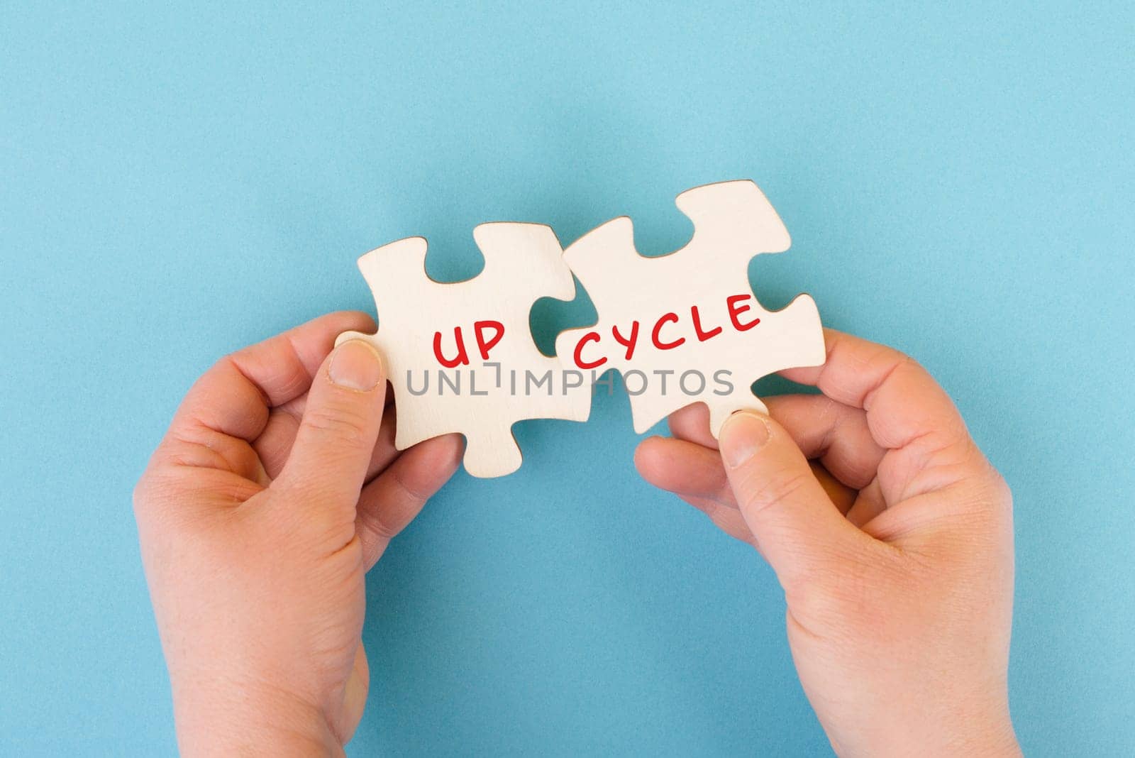 The word up cycle is standing on puzzle pieces, environmental conversation, reuse and repair concept, responsibility with resources, zero waste