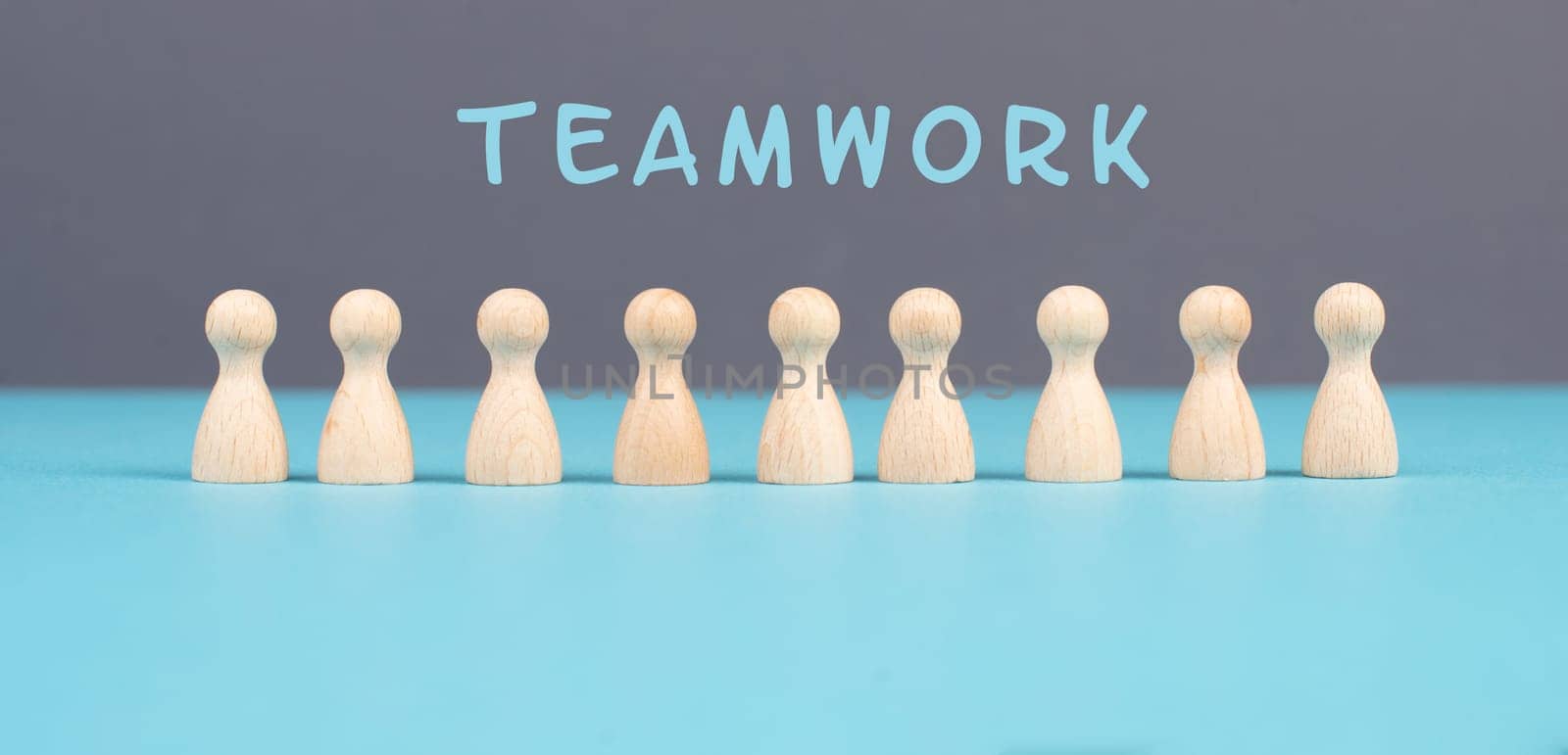The word teamwork is standing over a group of people, working together as a team, corporation, communication and support concept