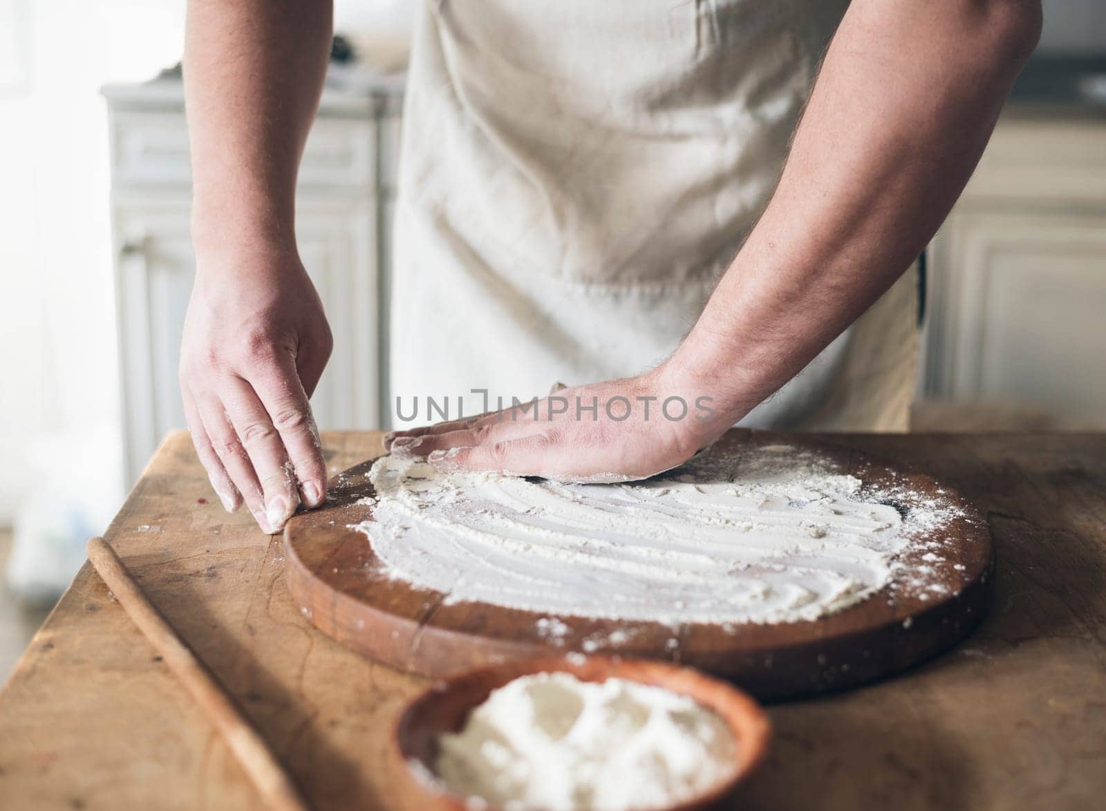 Man baking bread in the kitchen.