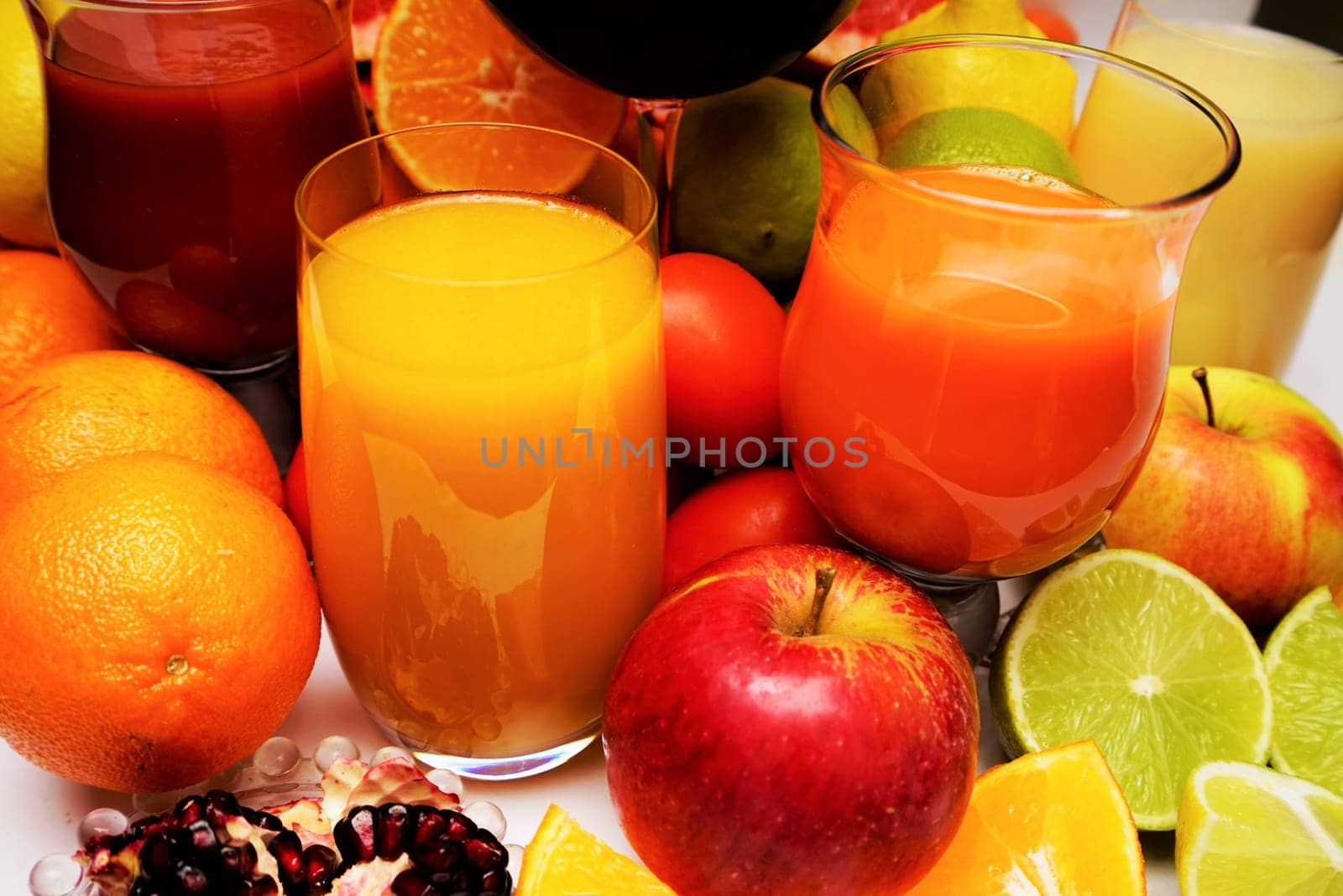 Healthy fruit and vegetable juices on a white background