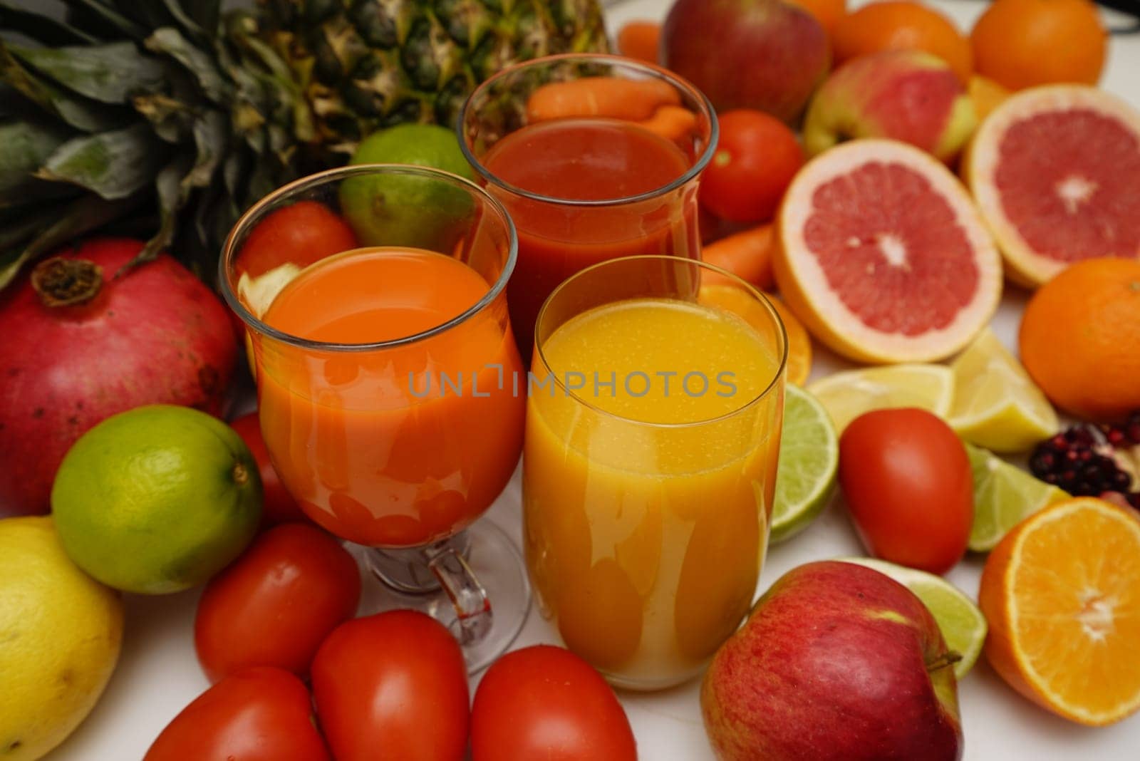 Healthy fruit and vegetable juices on a white background