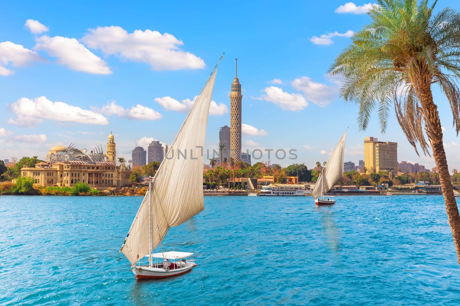 Feluccas in the Nile in front of the Tower of Cairo, Egypt.