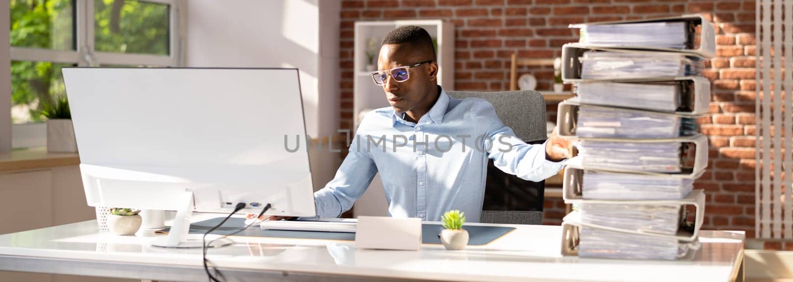 Businessperson Pushing Paper Documents Away And Working With Digital Documents On Computer Instead