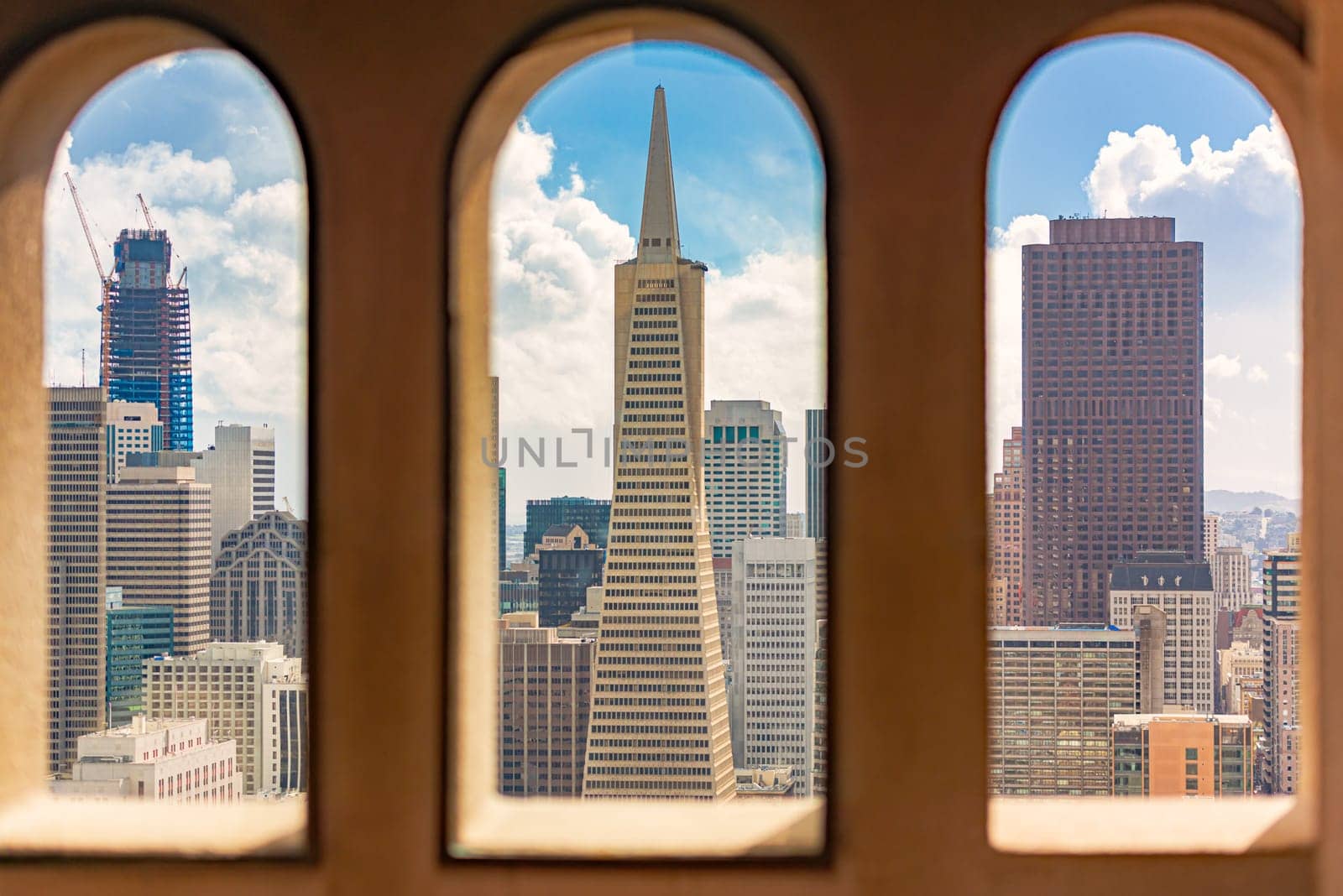 San Francisco city downtown view from Coit tower with blue cloudy sky in background. California, USA