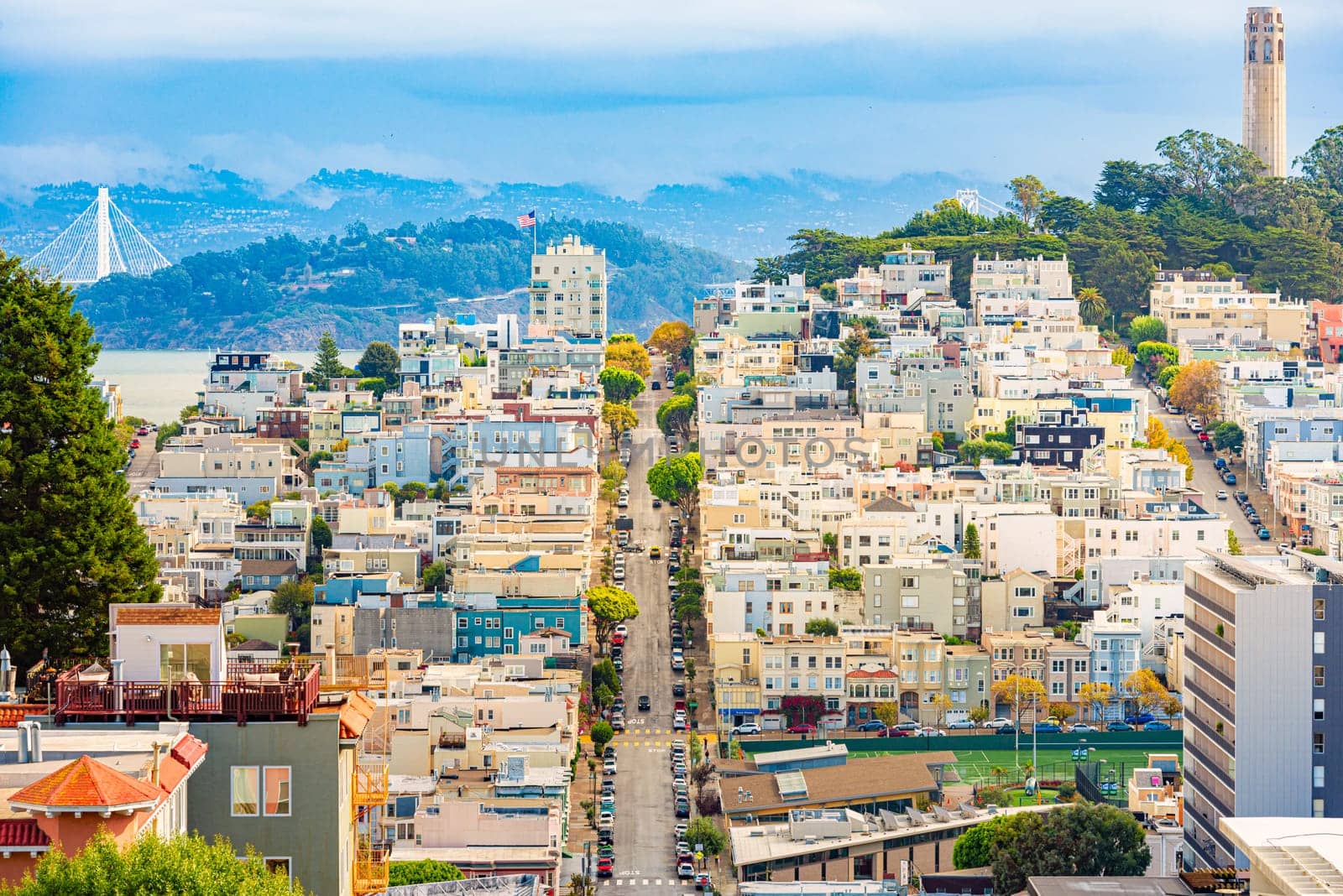 San Francisco city view with Coit tower and blue cloudy sky in background. California, USA