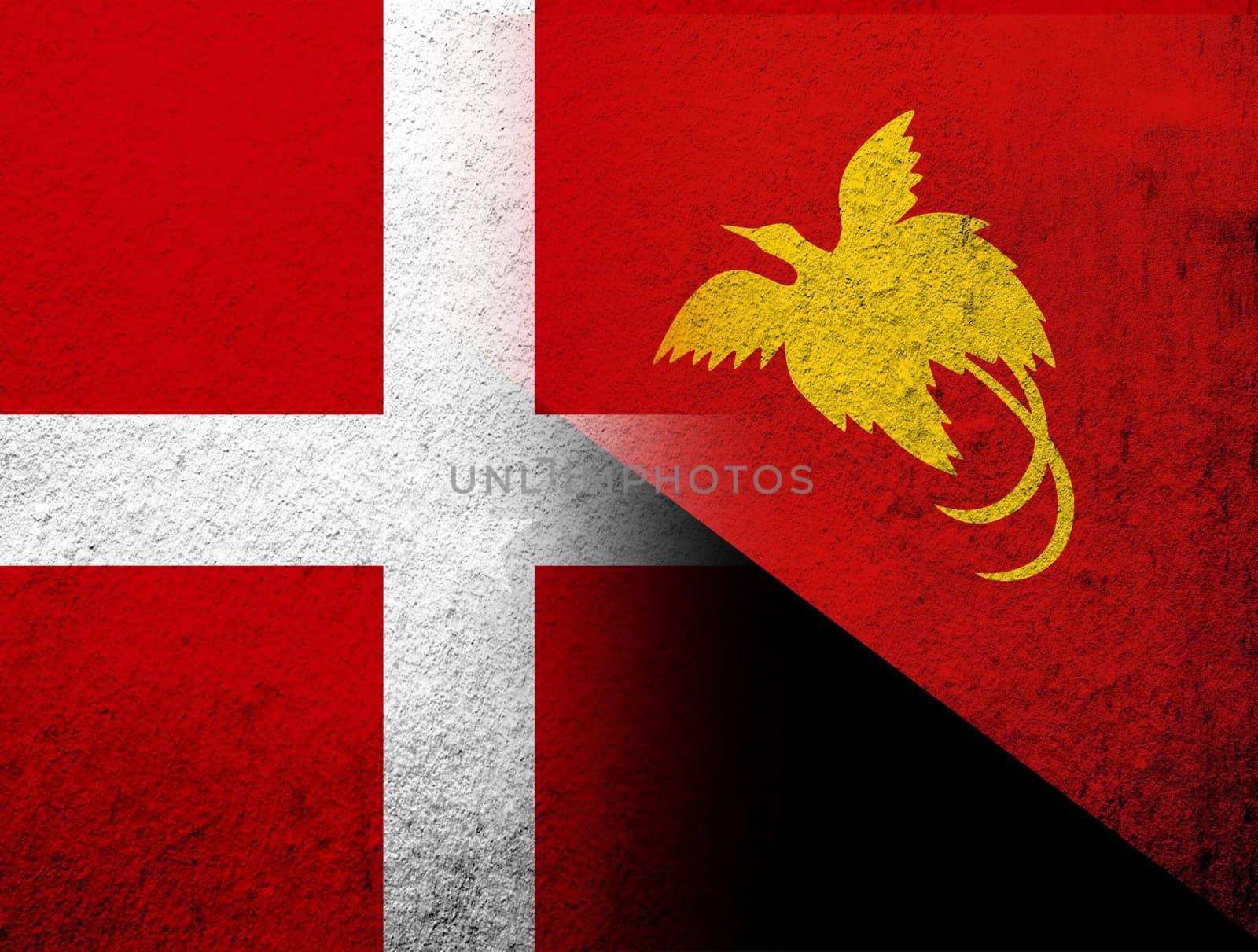 the Kingdom of Denmark National flag with The Independent State of Papua New Guinea National flag. Grunge Background