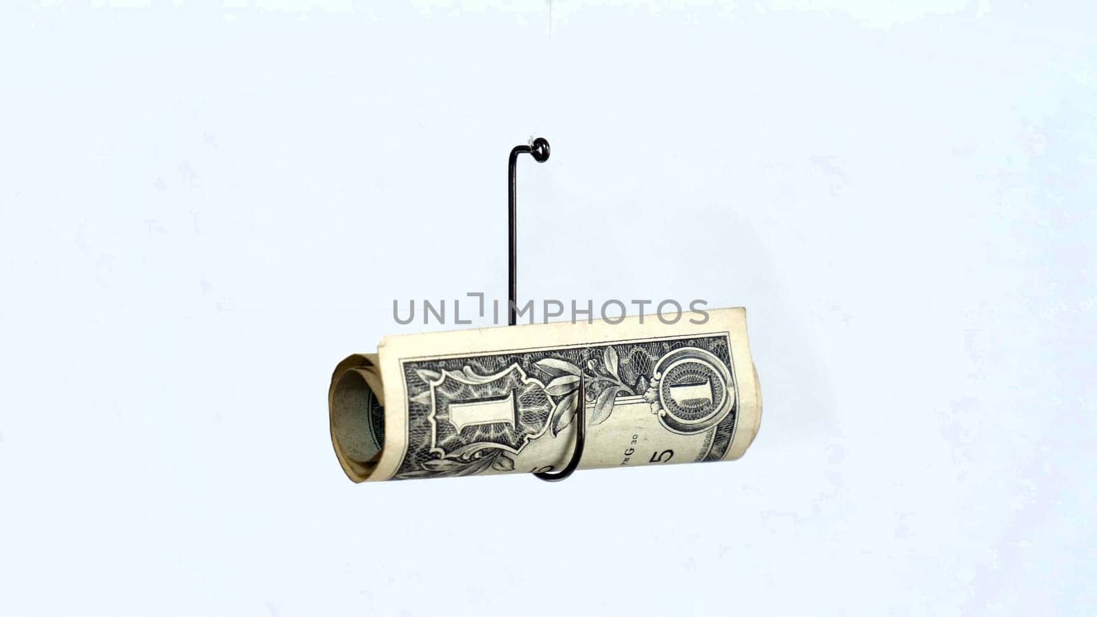 Dollar On A Fishing Hook Isolated On White Background