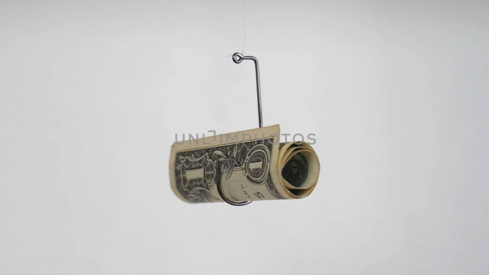 Dollar On A Fishing Hook Isolated On White Background