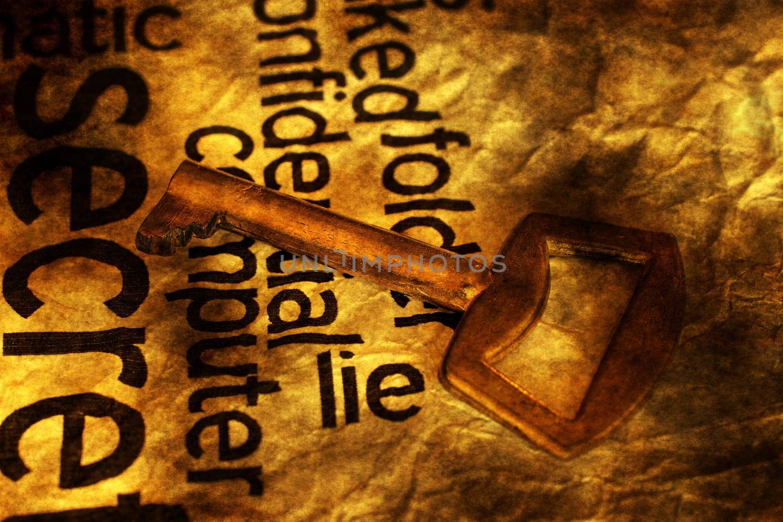 Golden key on lie text