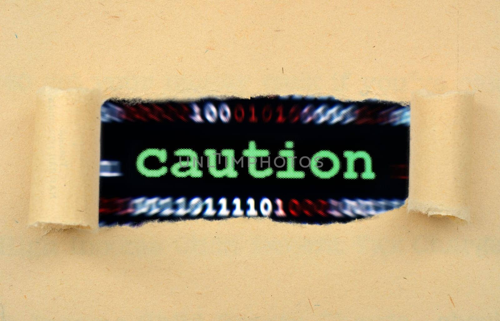 Caution text on ripped paper