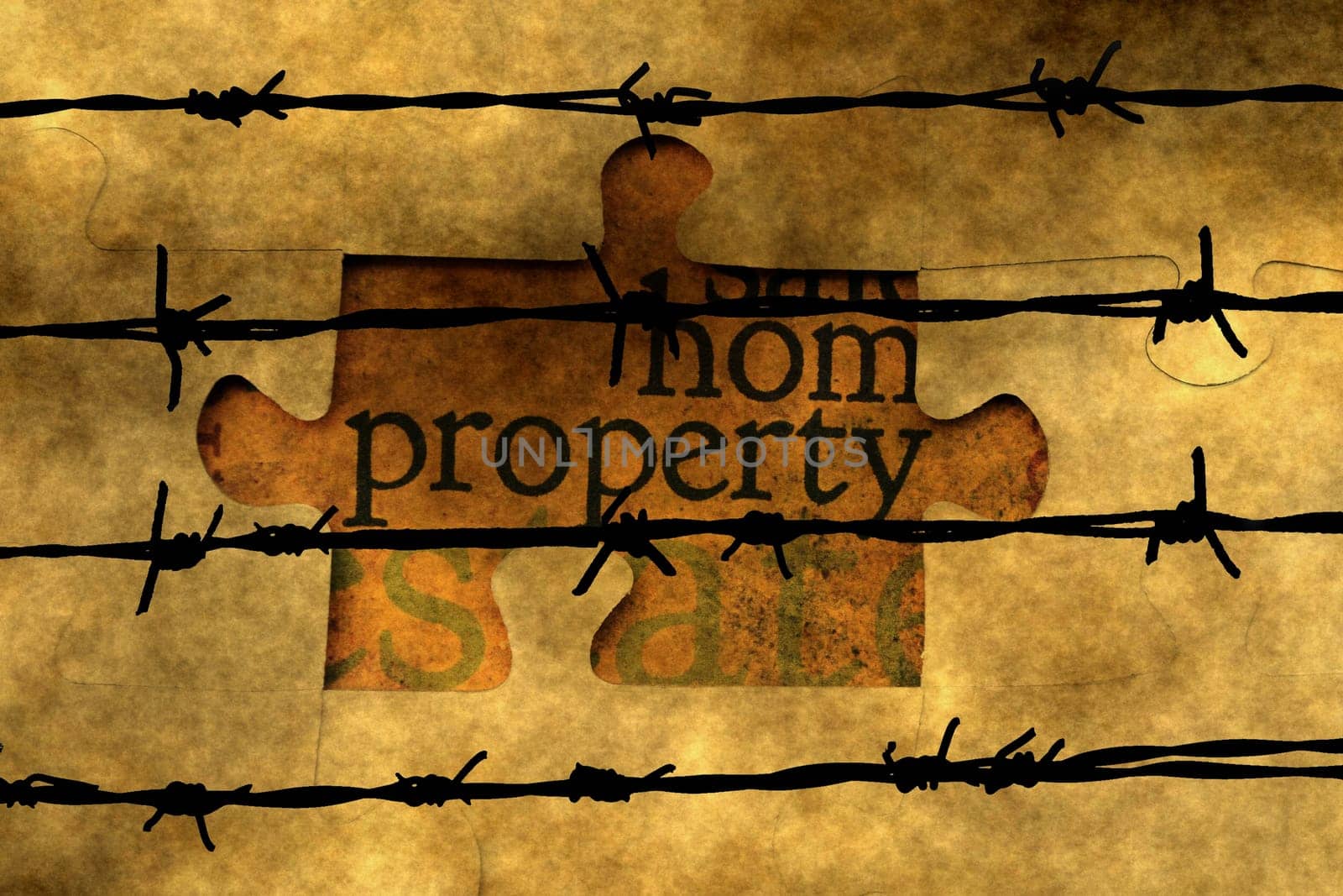 Property puzzle concept against barbwire