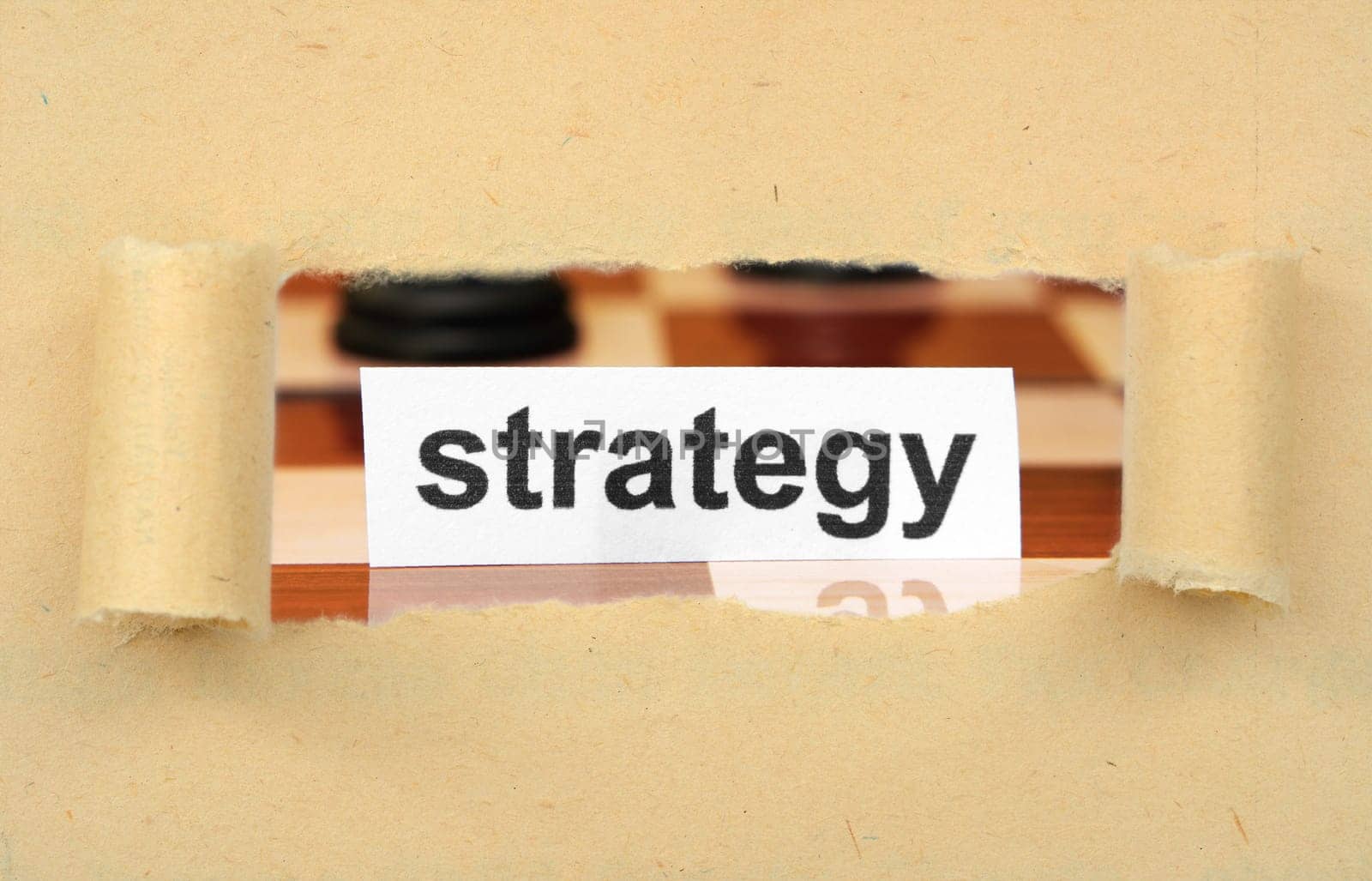 Strategy tag on ripped paper