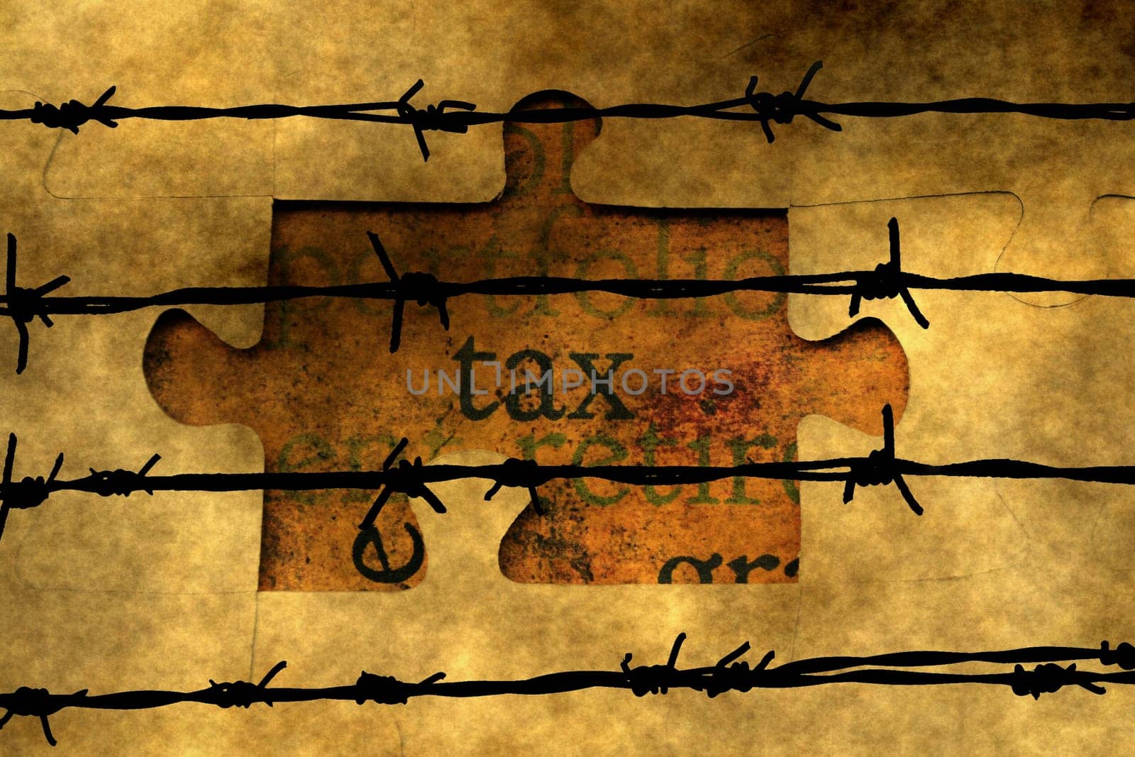 Tax puzzle concept against barbwire