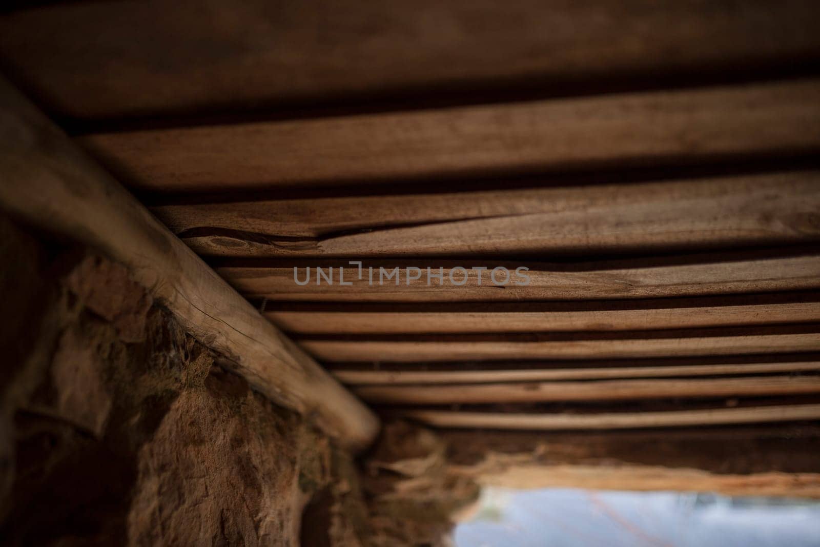Old board roof covering a shepherds hut. Selective focus