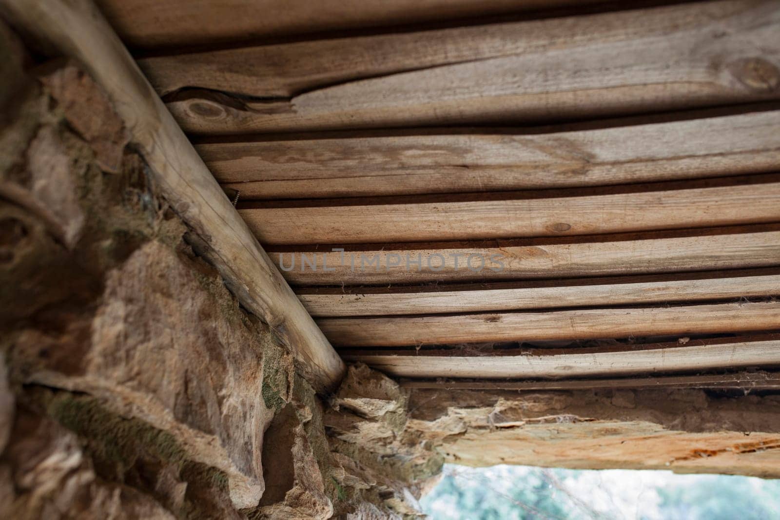 Old board roof covering a shepherds hut. Selective focus