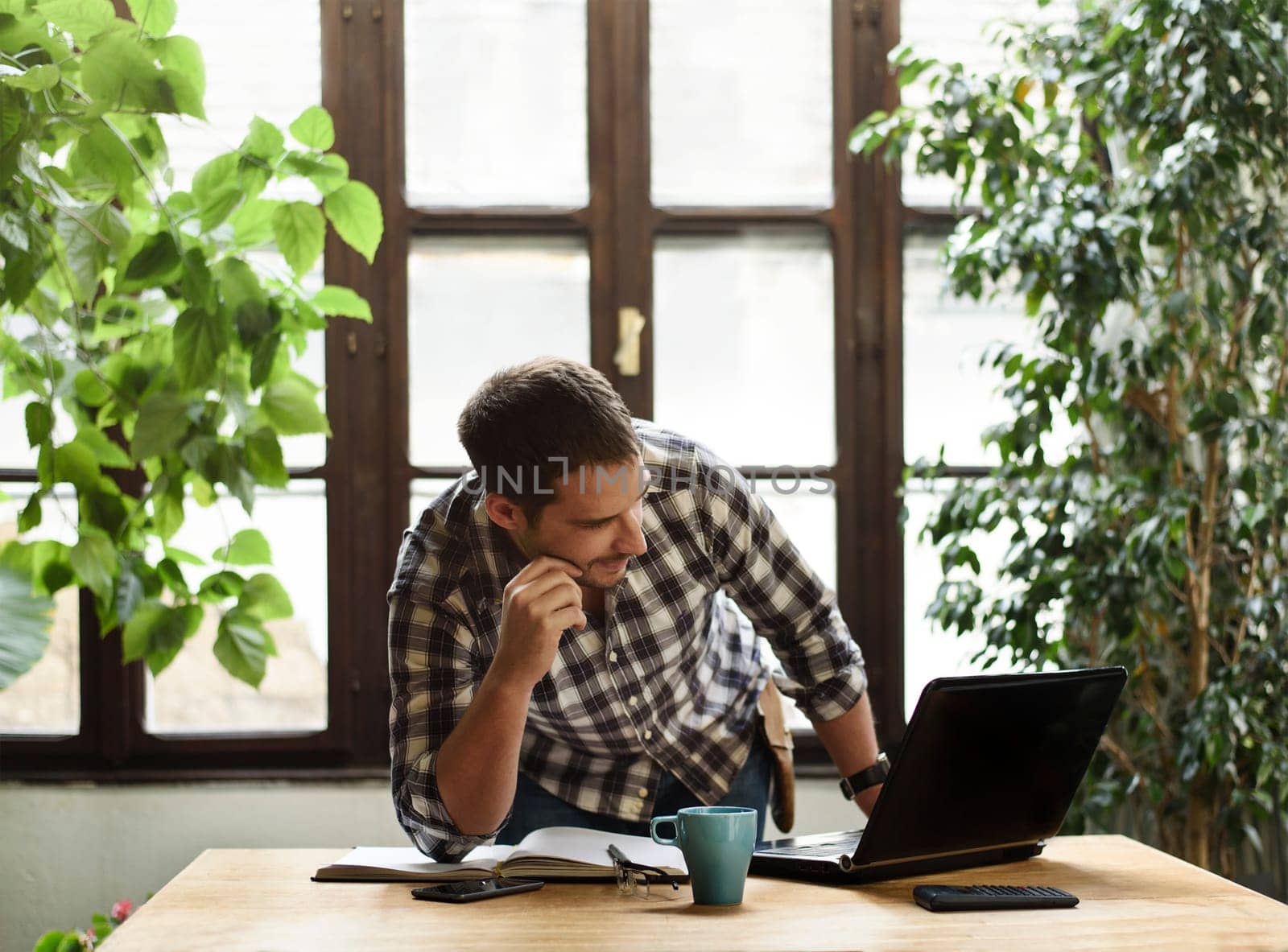 Young man working in cool workspace