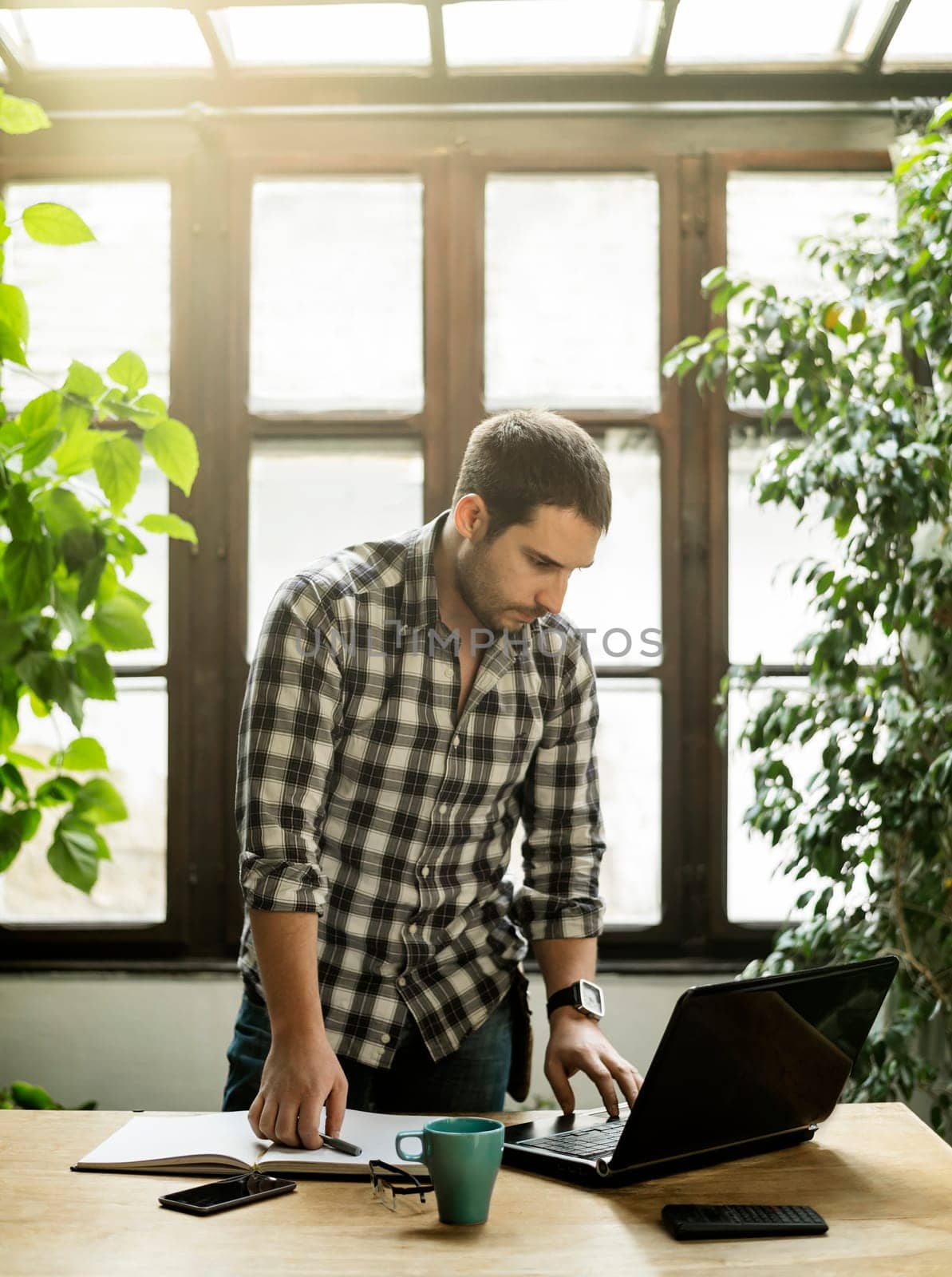 Young man working in cool workspace