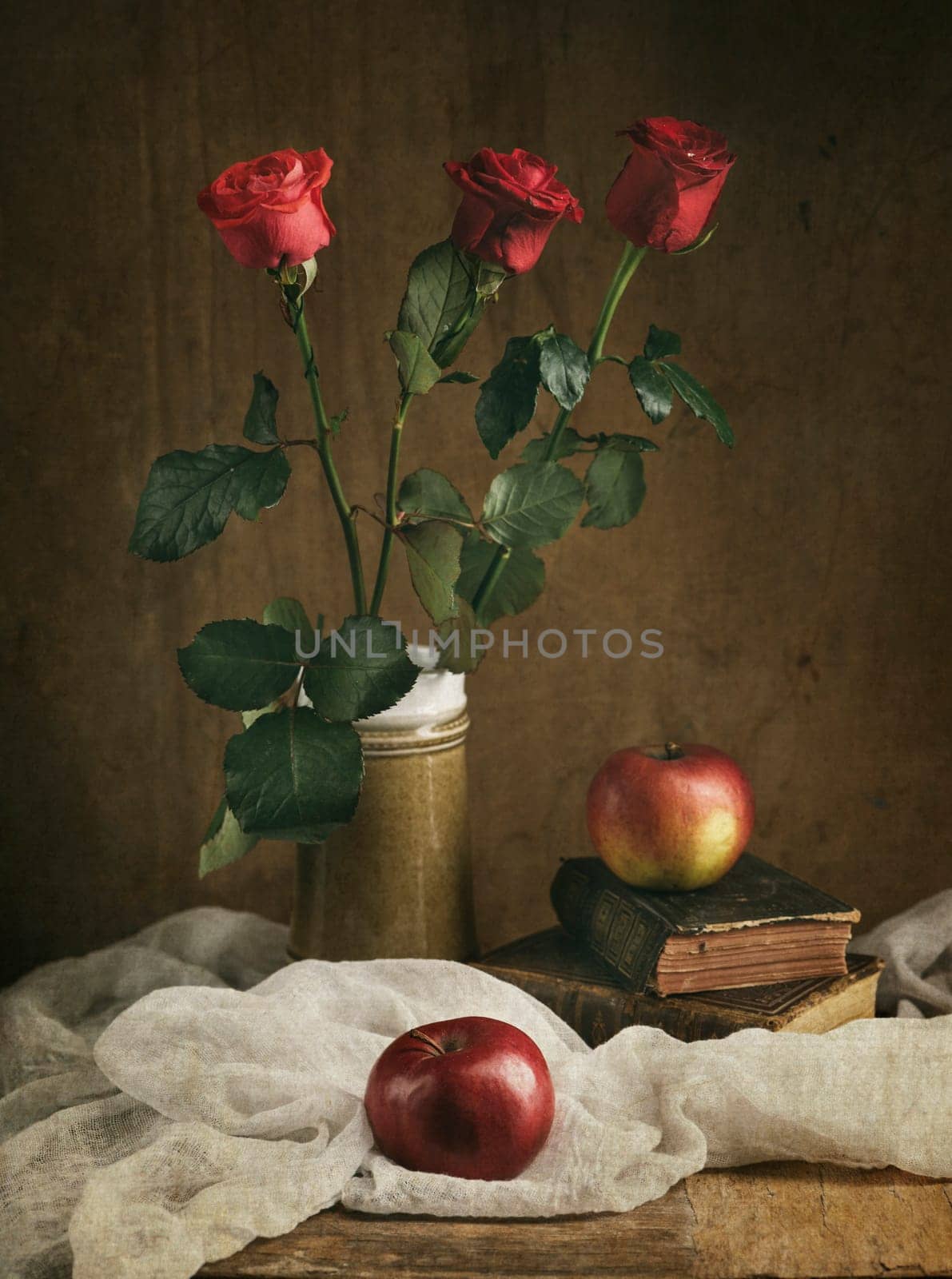 Still life with red roses and apples.