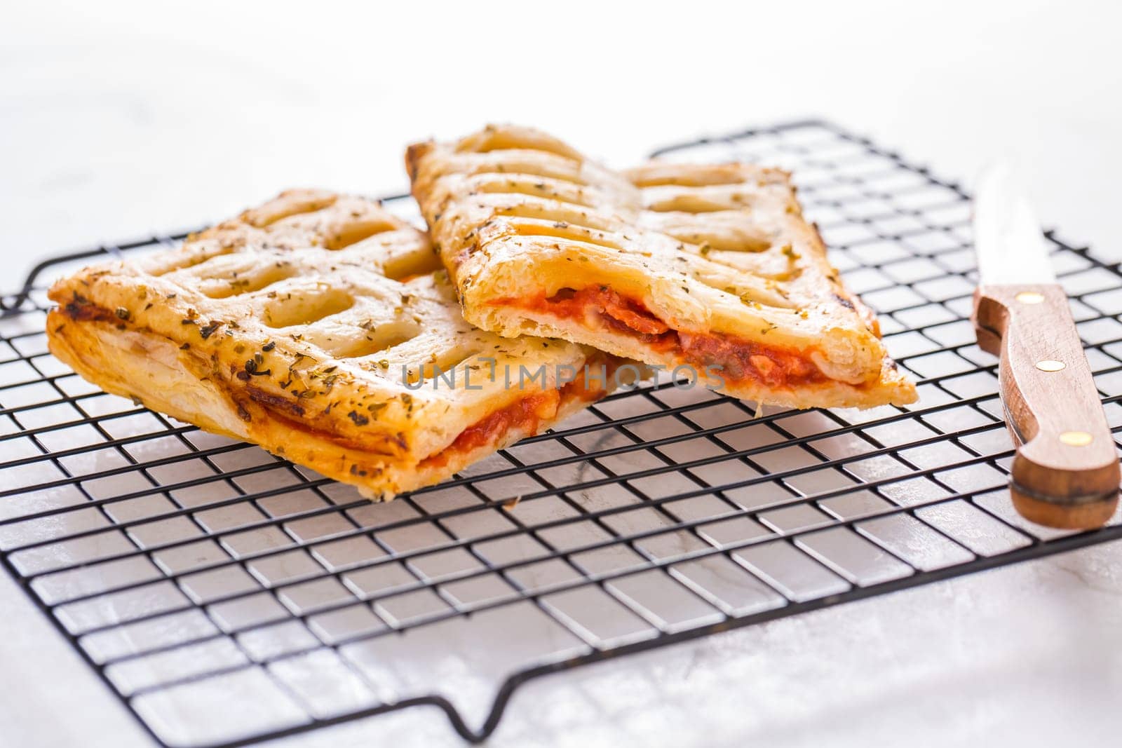 Puff pastry vegetable pie with tomatoes, onions, herbs and eggplant