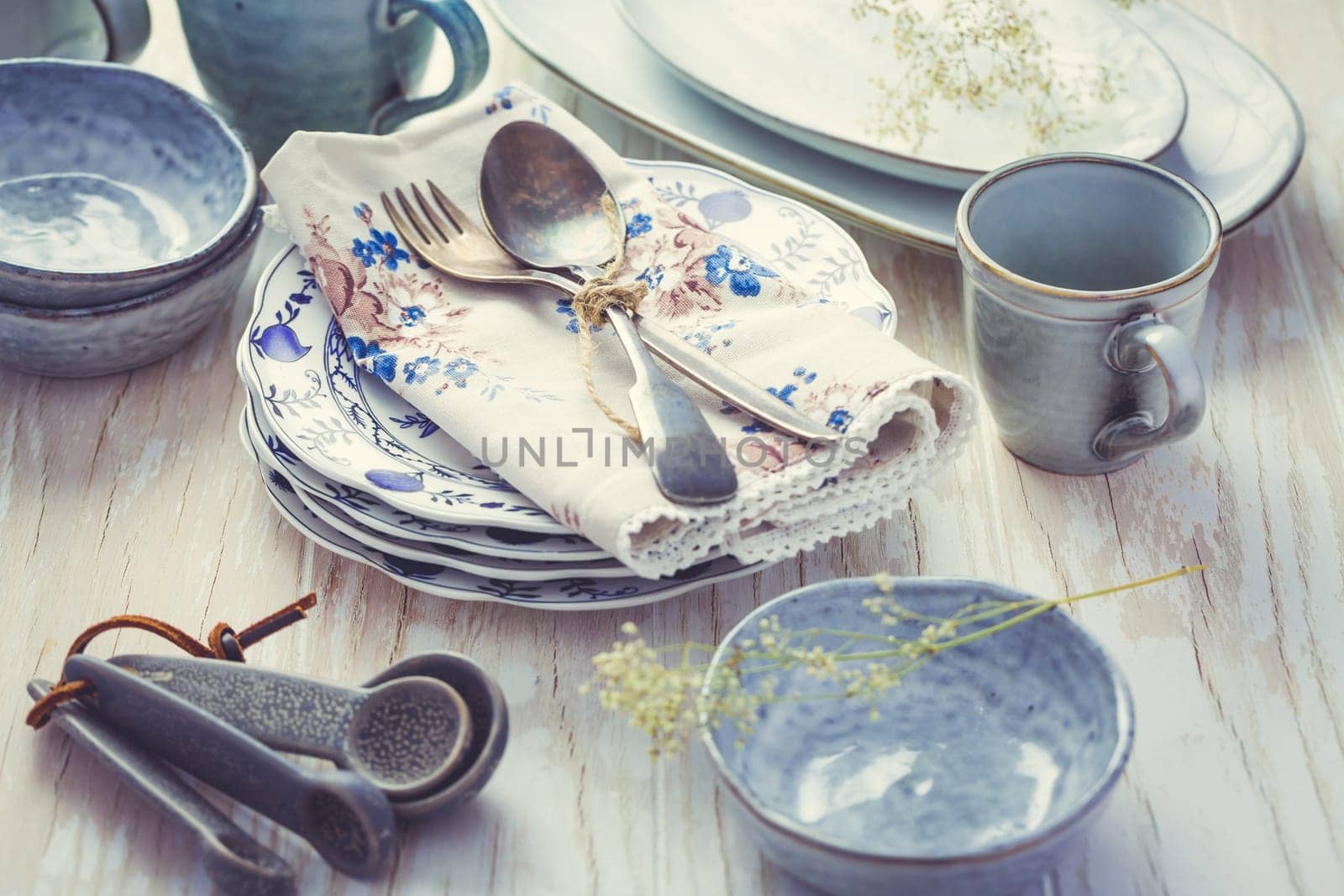 Sustainability concept - stoneware and kitchenware on wooden kitchen table