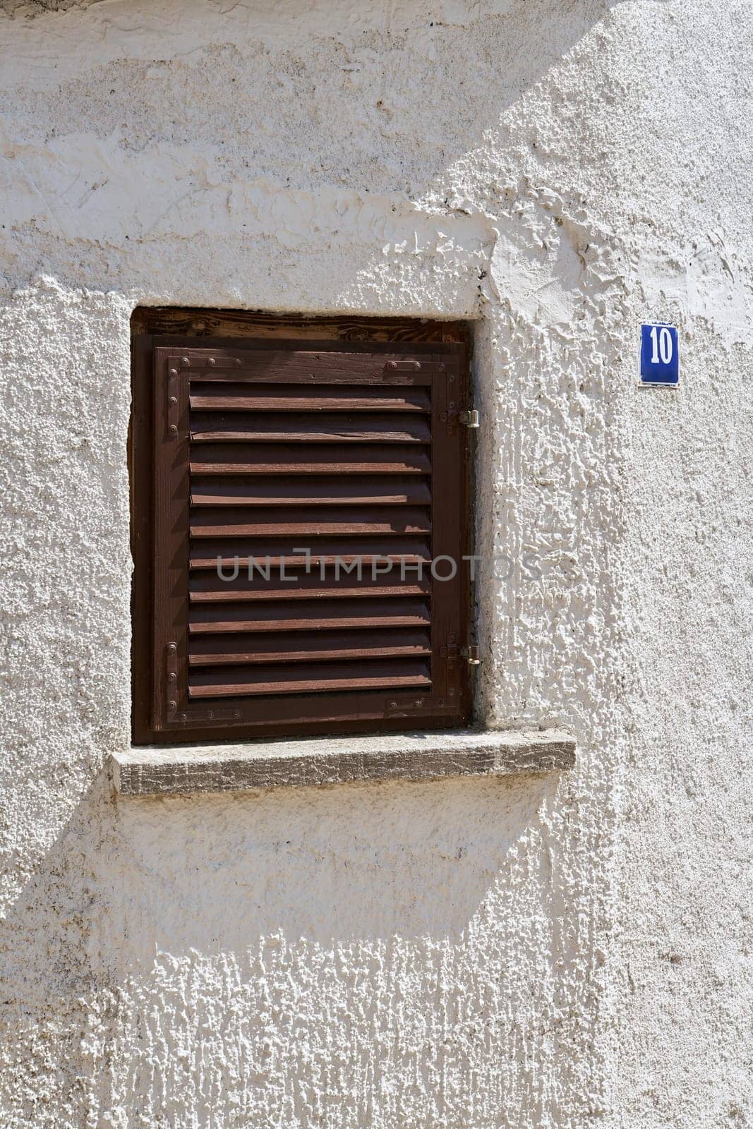 single window with shutter in the old town of Krk in Croatia