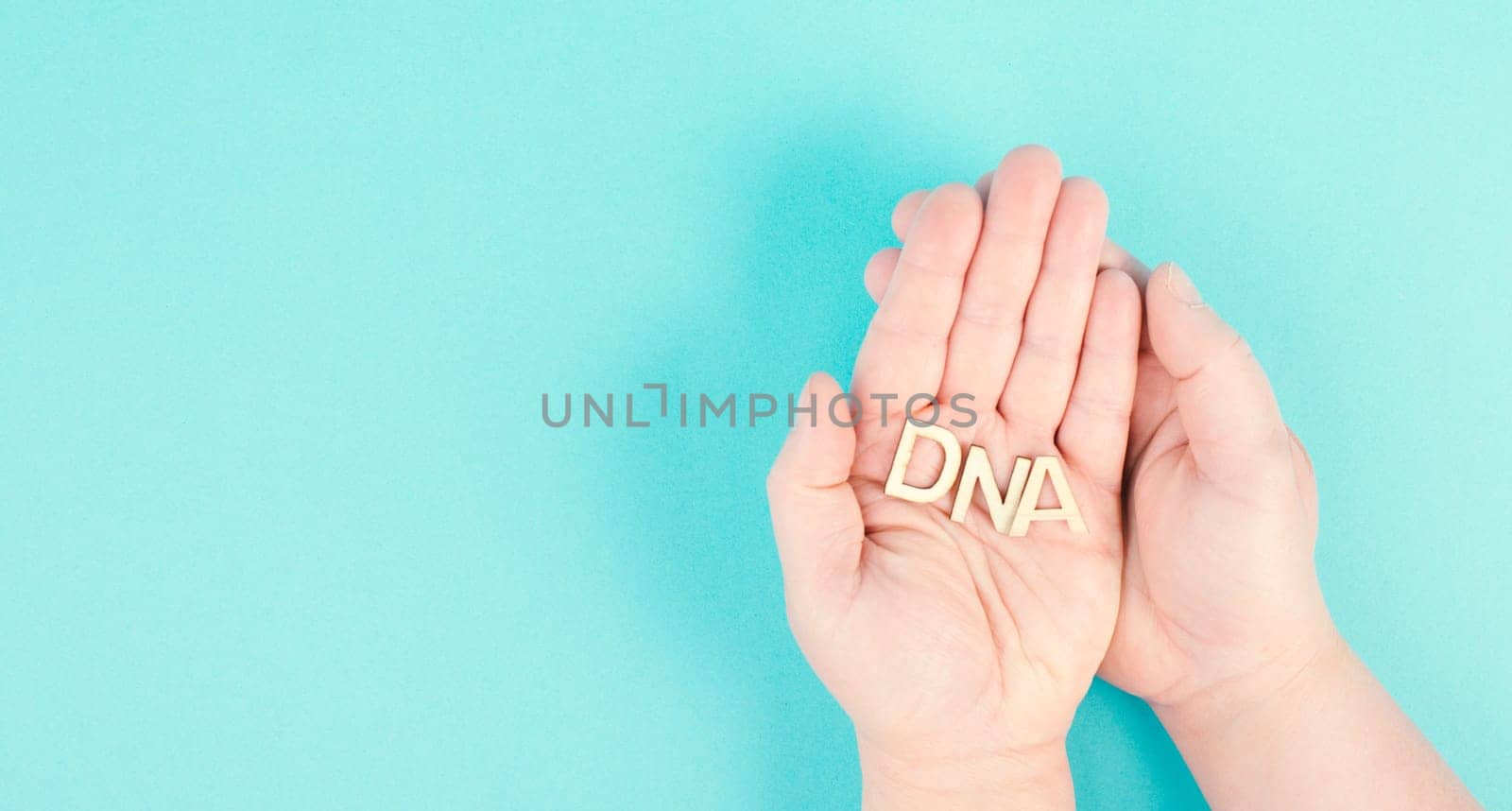Holding the word DNA in the hands, genetic therapy and treatment, biotechnology in mordern medicine, health care
