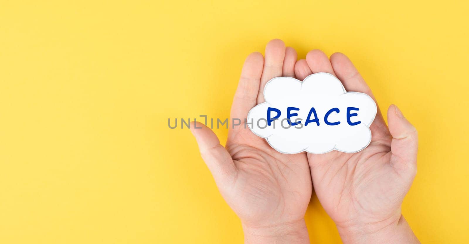Holding a cloud with the word peace in the hands, stop war, support Ukraine, living peaceful together, color of ukrainian flag