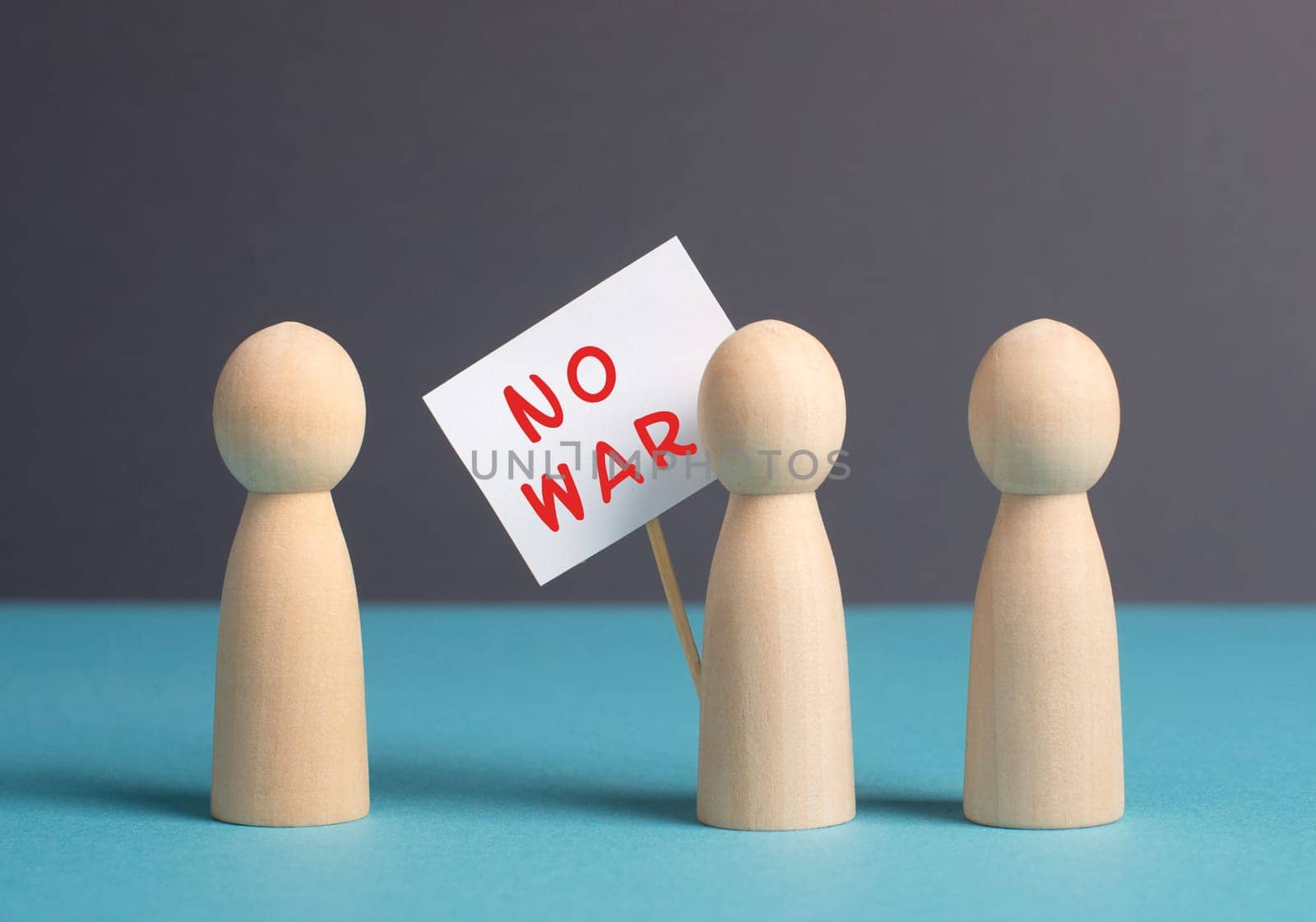 Group of protesters holding a sign with the words no war, demonstration for human right and freedom, political movement, activists for peace
