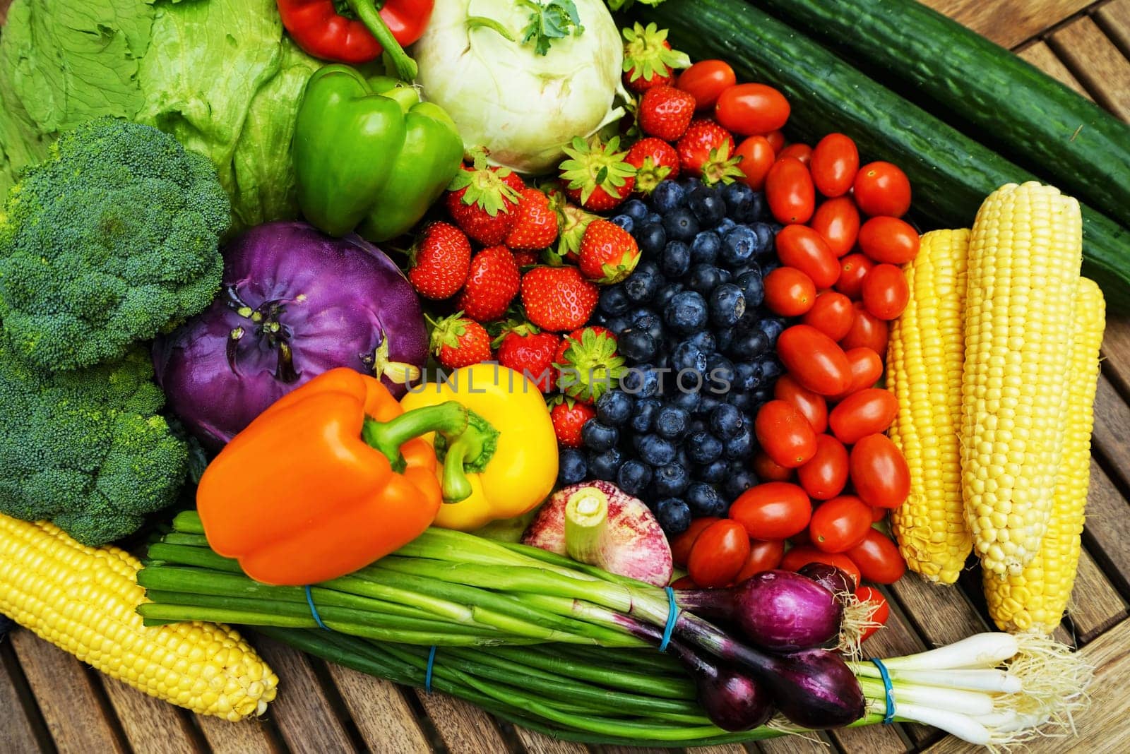 Fresh healthy fruits and vegetables on a wooden table