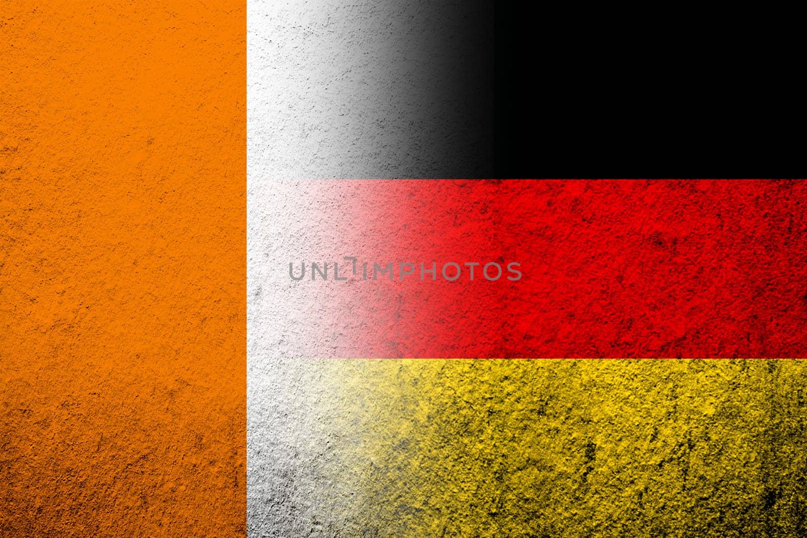 The national flag of Germany with Ivory Coast National flag. Grunge background