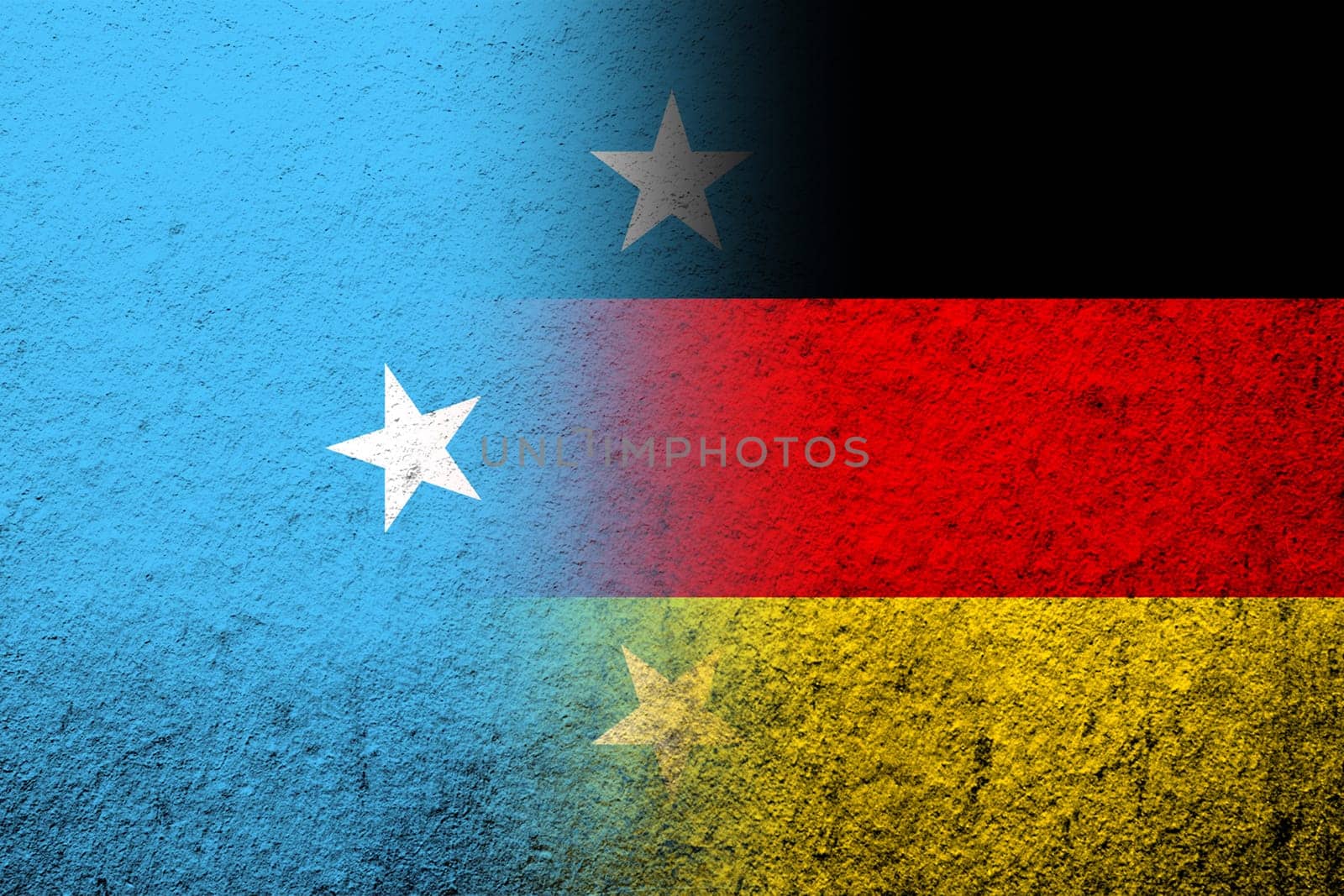 The national flag of Germany with Micronesia national flag. Grunge background
