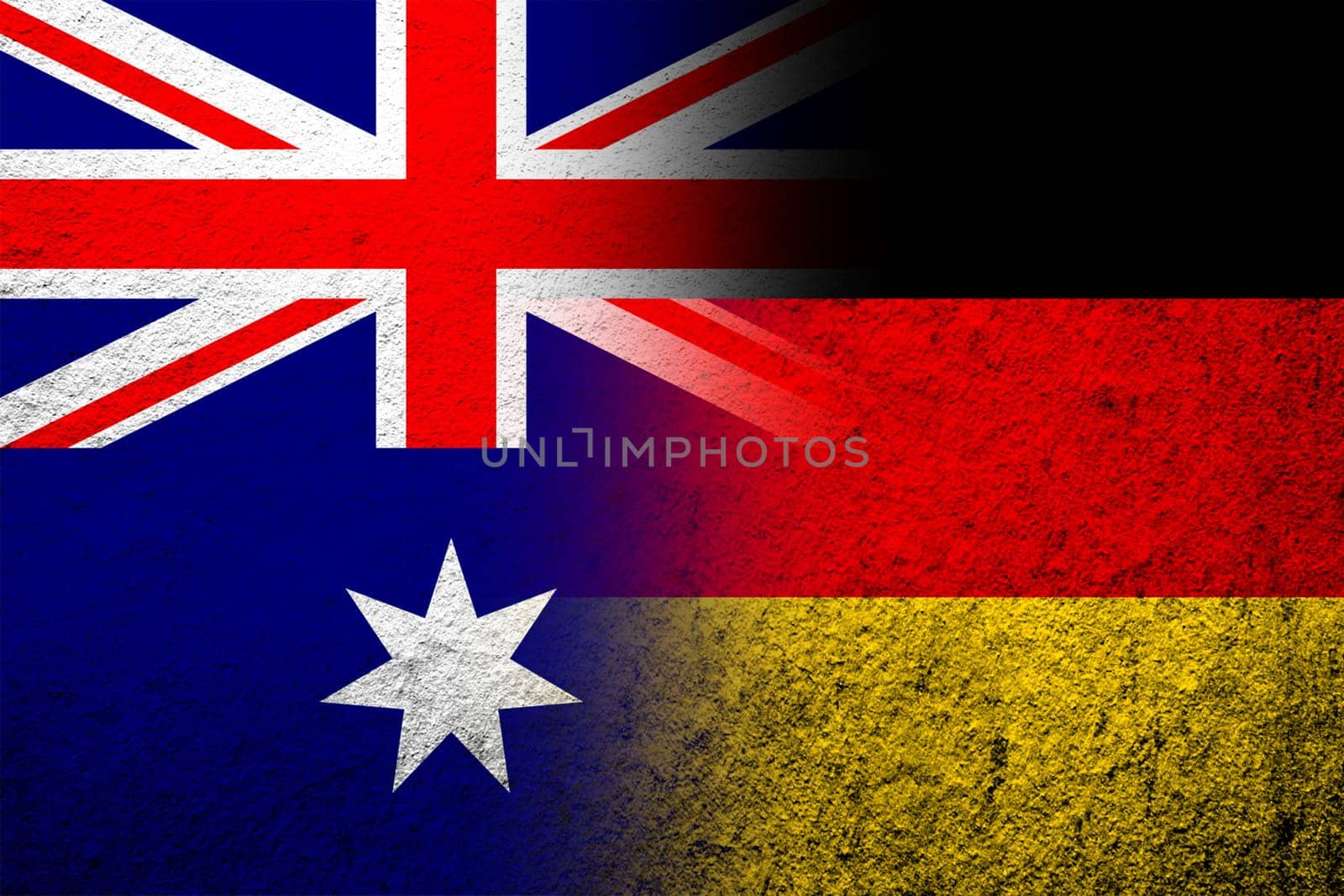 The national flag of Germany with National flag of Australia. Grunge background
