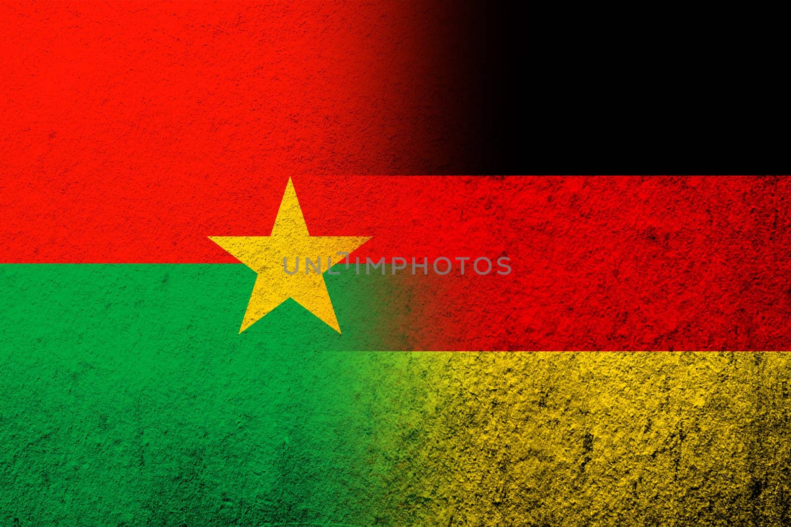 The national flag of Germany with National flag of Burkina Faso. Grunge background