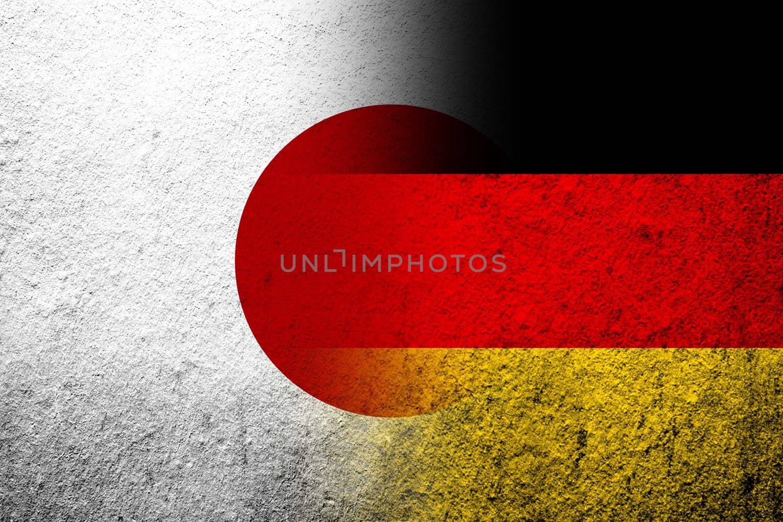 The national flag of Germany with National flag of Japan. Grunge background