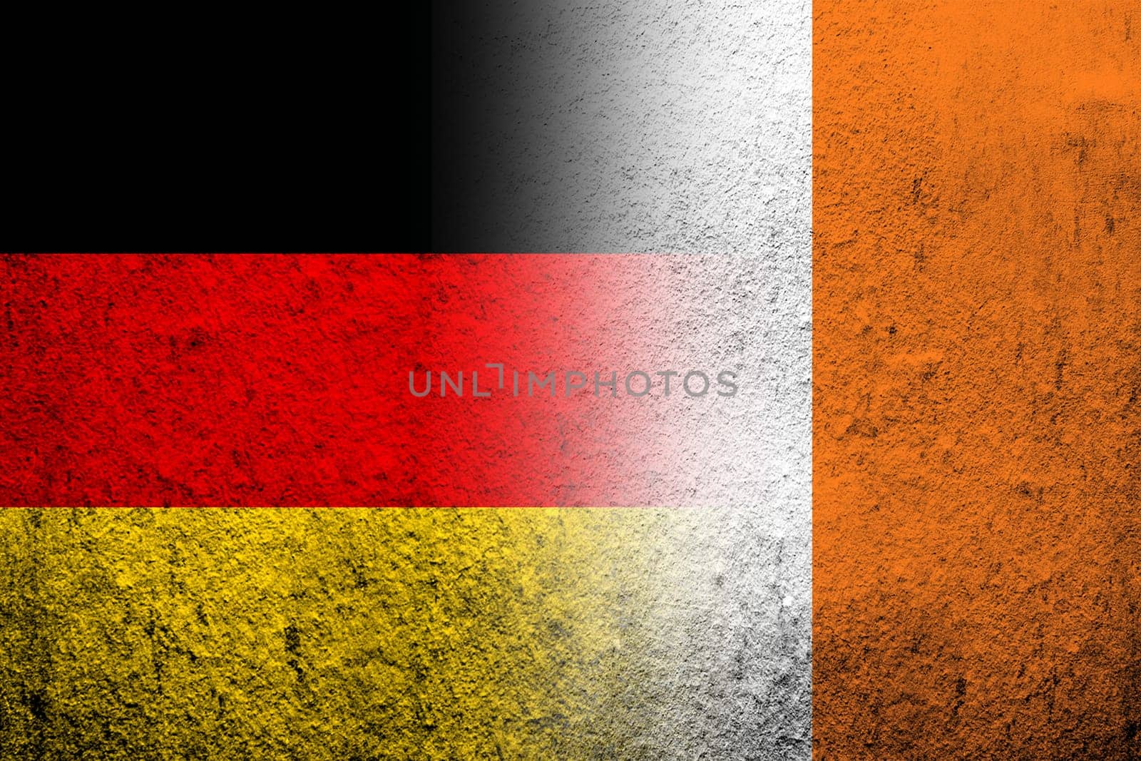 The national flag of Germany with The Republic of Ireland National flag. Grunge background
