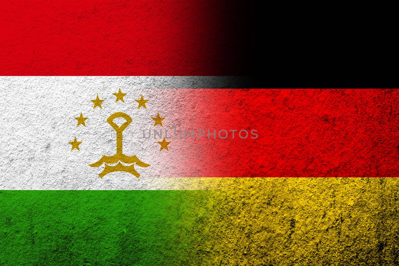 The national flag of Germany with The Republic of Tajikistan National flag. Grunge background