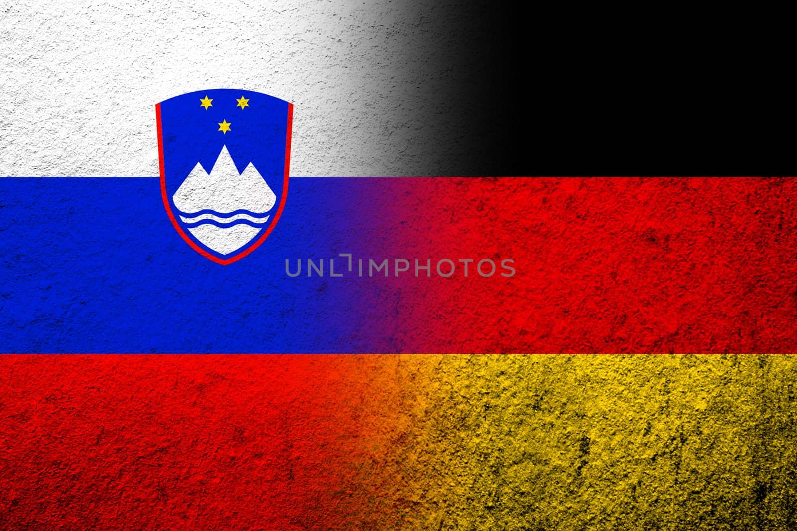 The national flag of Germany with The Republic of Slovenia National flag. Grunge background