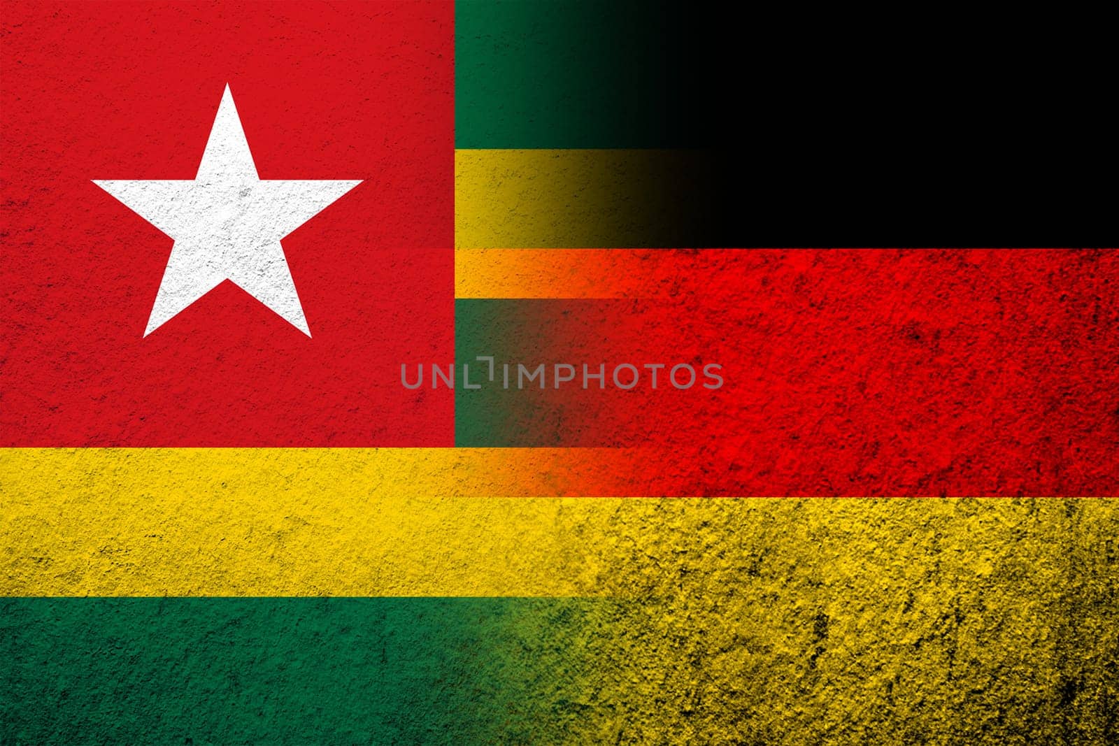 The national flag of Germany with The Togolese Republic Togo National flag. Grunge background