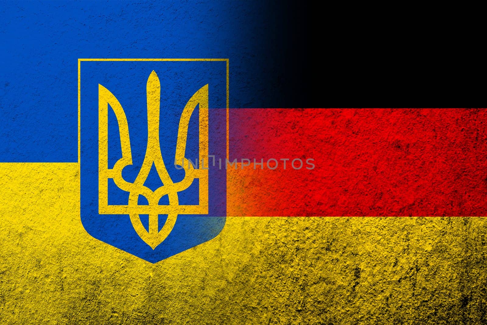 The national flag of Germany with Ukrainian national flag with Coat of arms of Ukraine tryzub. Grunge background