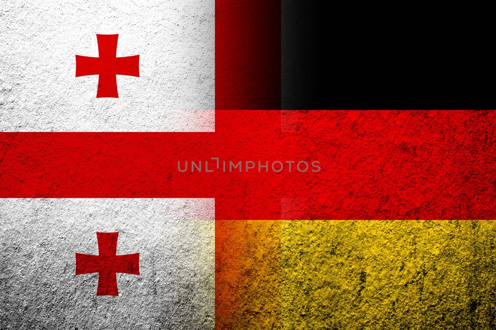 The national flag of Germany with The national flag of the country of Georgia. Grunge background