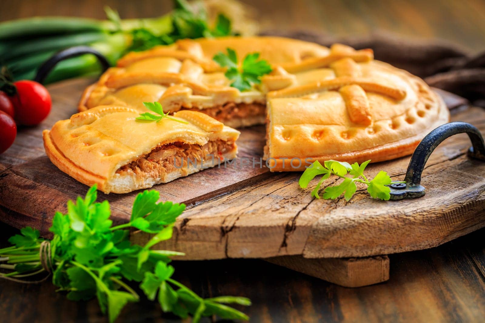 Empanada Gallega - traditional pie stuffed with tuna, Galician and Spanish cuisine. Tart with tuna and vegetables.