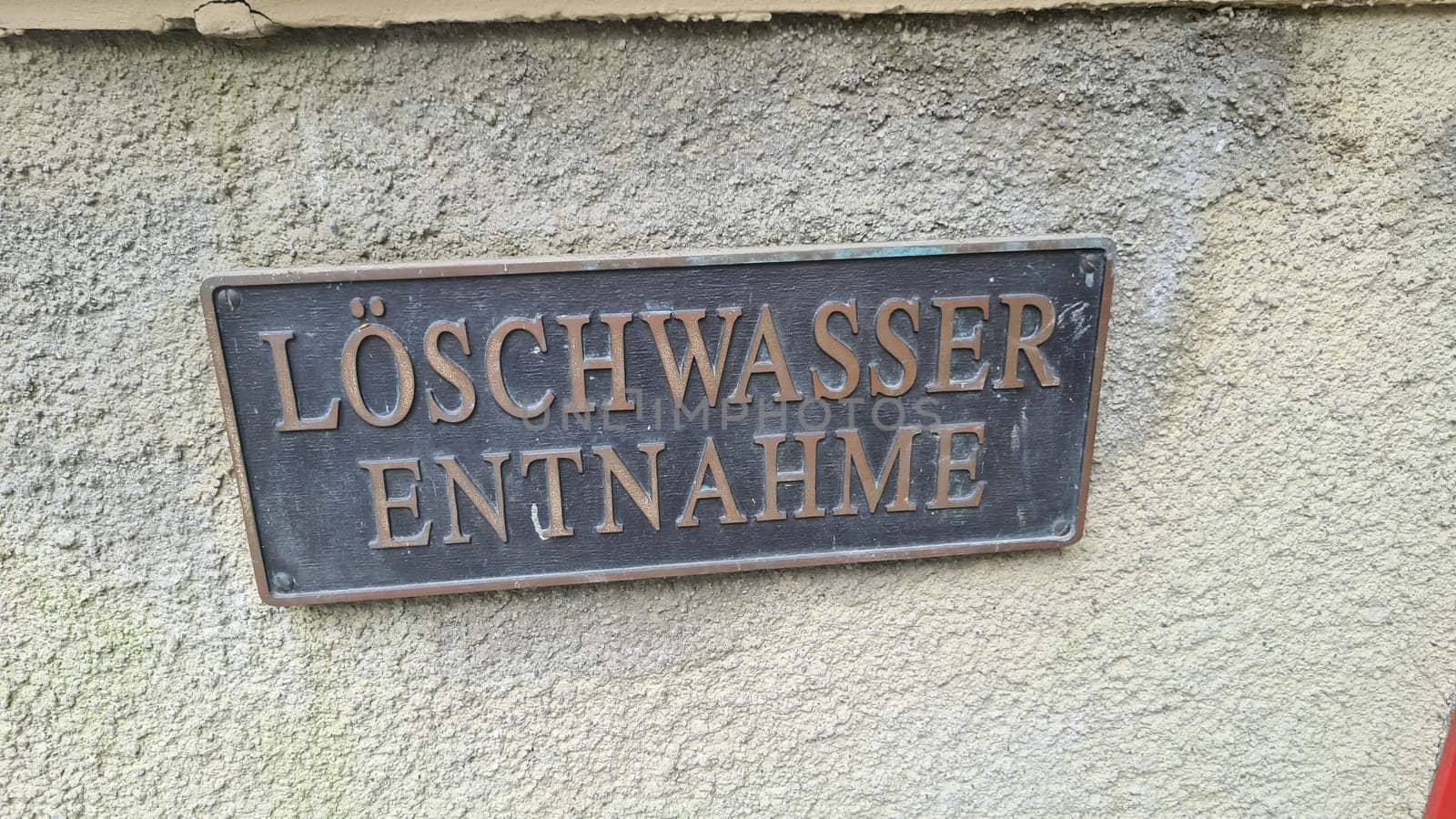 Metal sign with inscription in German - fire water extraction point