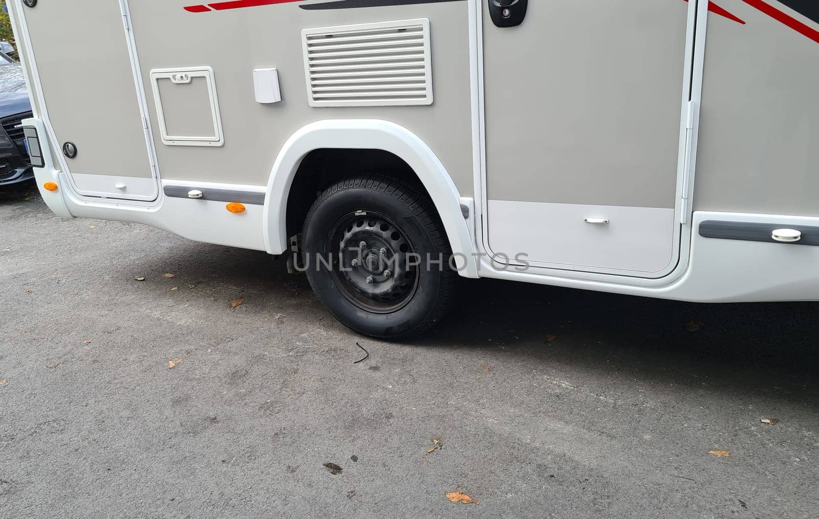 Motorhomes or campervans changing tires in the workshop from winter to summer or all-season tires